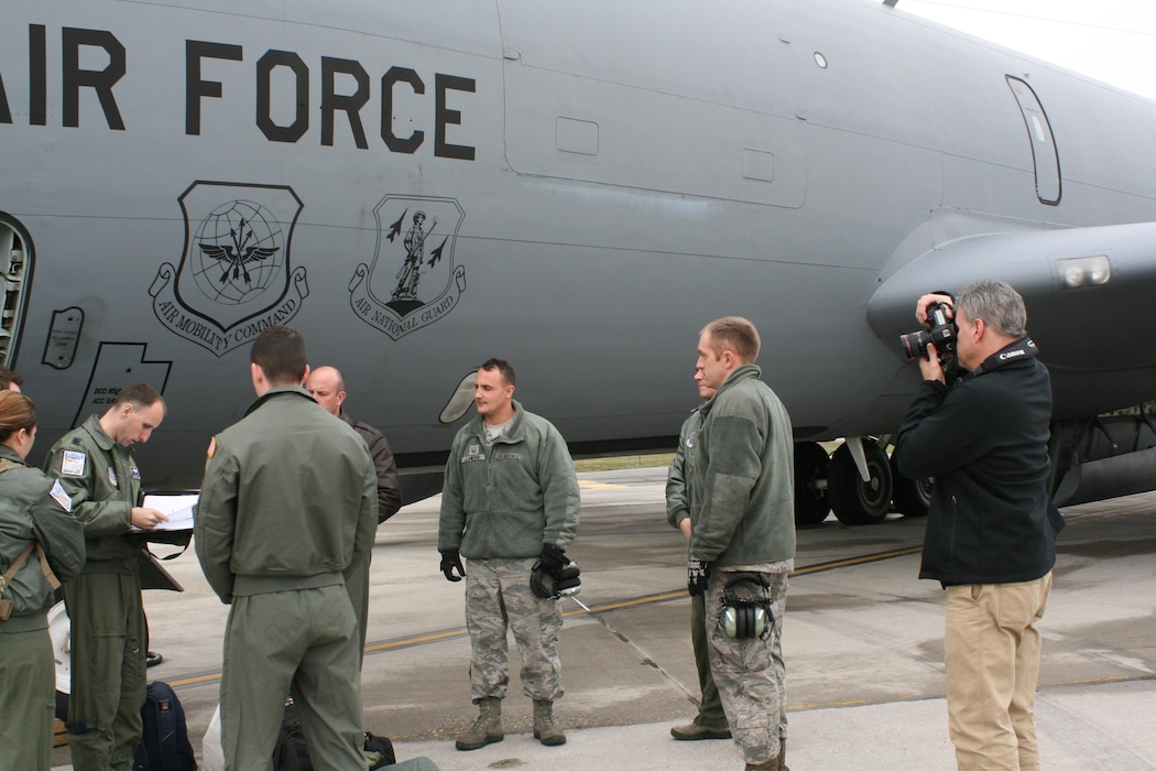 Rick Llineras, Air Force Magazine senior photographer, captures images of KC-135R Stratotanker aircraft commander Lt. Col. Zack Love giving pre-flight instructions Feb. 22, 2017 at Roland R. Wright Air National Guard Base. Llineras visited the Utah Air National Guard and Hill Air Force Base as part of a photojournalism essay to be featured later this year highlighting Utah's total force initiatives. (U.S. Air National Guard photo by Maj. Jennifer Eaton) 
