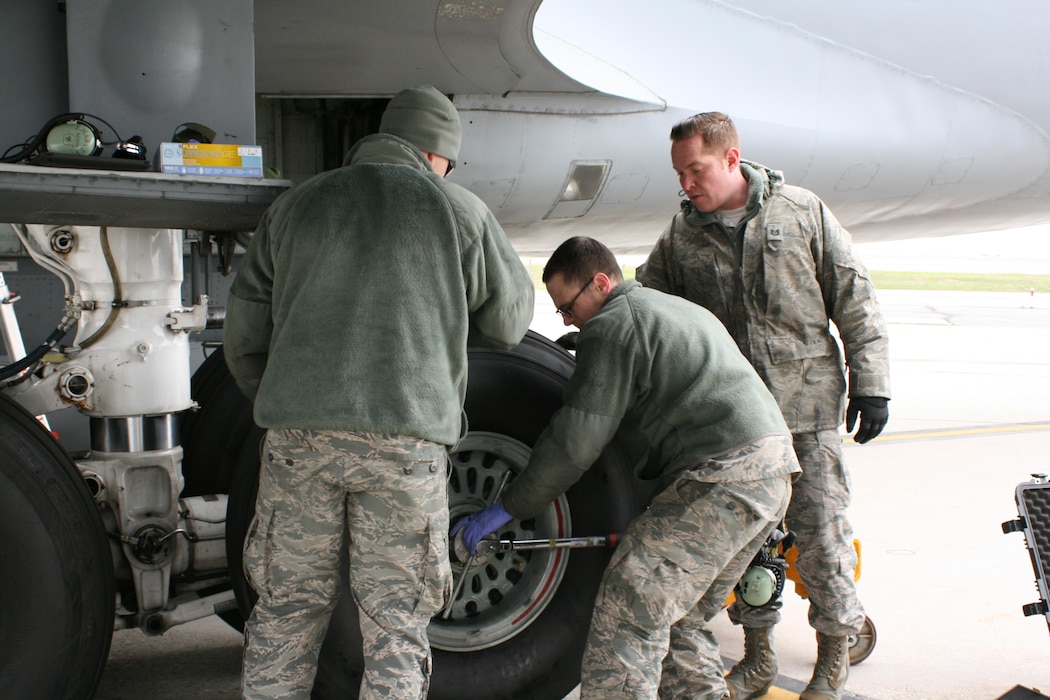 Tech. Sgt. Austin Naylor, Tech. Sgt. Quinton Harward, and Tech.Sgt. Zachariah Harvey, with the 151st Maintenance Group, conduct a tire and brake change on a KC-135R Stratotanker on the flight line at Roland R. Wright Air National Guard Base Feb. 22, 2017, due to a cracked brake heat shield. The entire process takes three to four hours to complete. (U.S. Air National Guard photo by Maj. Jennifer Eaton)
