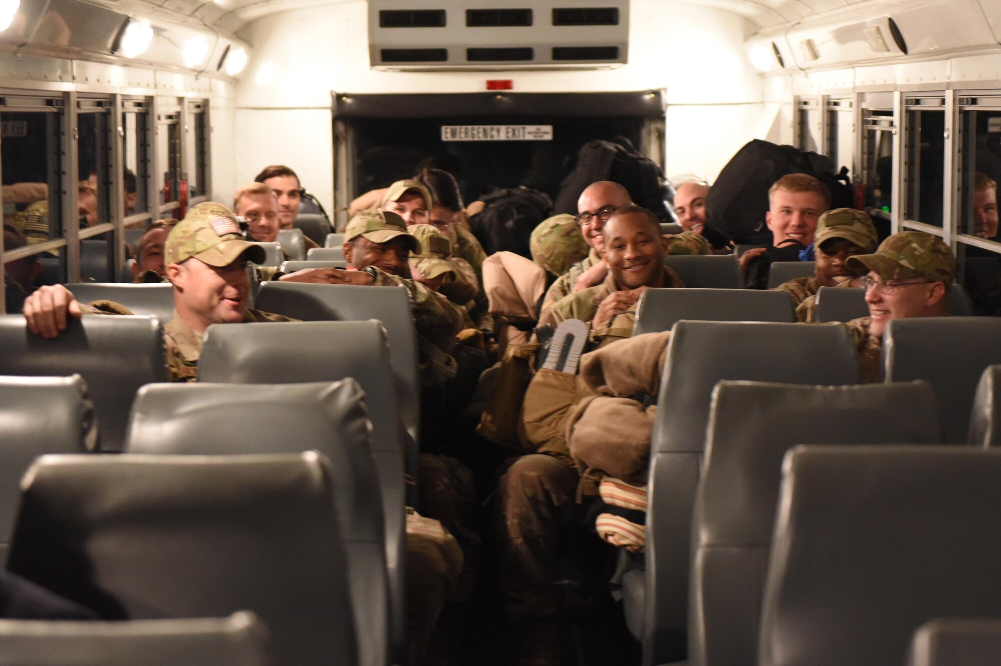 Airmen from the 621st Contingency Response Wing ride a bus after deboarding a military aircraft at Joint Base McGuire-Dix-Lakehurst, N.J., upon completing a four-month deployment in support of Operation Inherent Resolve, March 6, 2017. The 621st CRW—America’s only CRW—is a unique, bi-coastal unit whose forces are primarily stationed at both JB-MDL and Travis Air Force Base, Calif. (U.S. Air Force photo by Airman 1st Class Zachary Martyn/RELEASED)