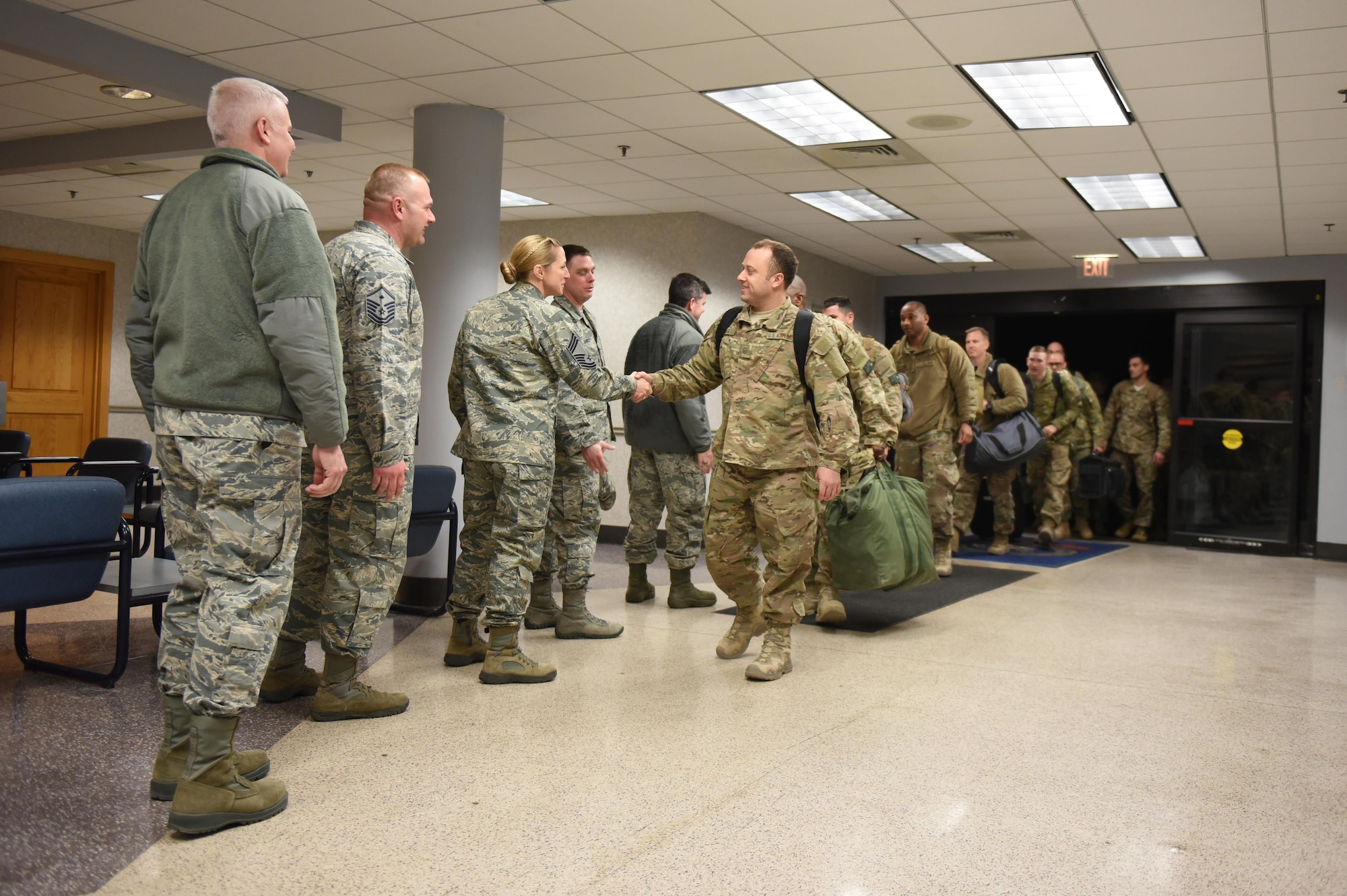 Airmen from the 621st Contingency Response Wing are welcomed home at Joint Base McGuire-Dix-Lakehurst, N.J., upon completing a four-month deployment in support of Operation Inherent Resolve, March 6, 2017. The 621st CRW consists of approximately 1,500 Airmen assigned to three groups, 11 squadrons and more than 20 geographically-separated operating locations aligned with major Army and Marine Corps combat units. (U.S. Air Force photo by Airman 1st Class Zachary Martyn/RELEASED)