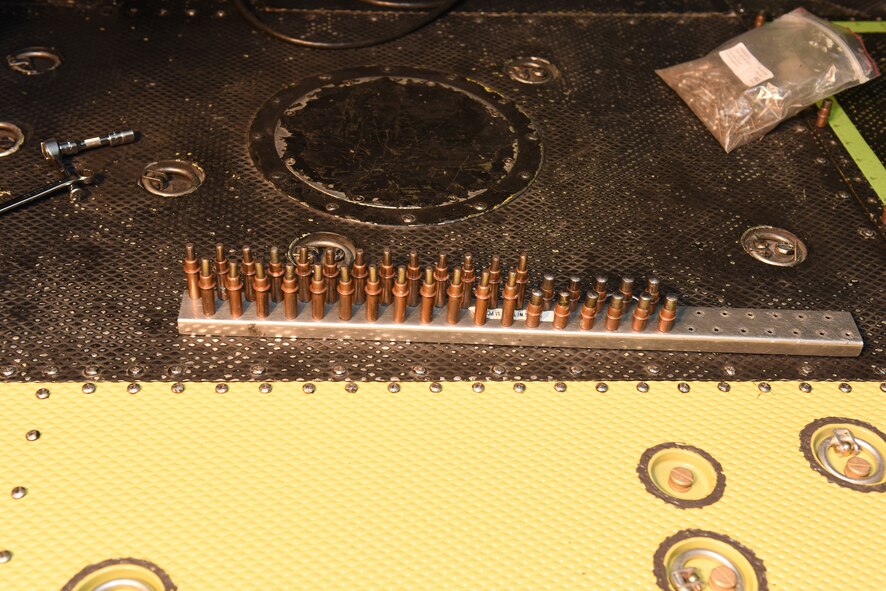 Studs are lined up prior to being used for installion of new floor paneling on a UH-1N Huey helicopter belonging to the 40th Helicopter Squadron during a scheduled phase maintenance inspection on the aircraft March 6, 2017, at Malmstrom Air Force Base, Mont.  The phase inspection period usually lasts 4-6 weeks and routinely occurs after 400 flight hours.  (U.S. Air Force photo/Jason Heavner)