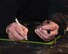 An aircraft mechanic marks where rivets are going to go as floor panels are installed on a UH-1N Huey helicopter during a scheduled phase maintenance inspection on the aircraft March 6, 2017, at Malmstrom Air Force Base, Mont.  The phase inspection period usually lasts 4 to 4 weeks and routinely occurs after 400 flight hours.  (U.S. Air Force photo/Jason Heavner)