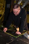 Bob Berg, M1 Support Services aircraft mechanic, installs new floor paneling on a UH-1N Huey helicopter during a scheduled phase maintenance inspection on the aircraft March 6, 2017, at Malmstrom Air Force Base, Mont.  The phase inspection period usually lasts 4 to 6 weeks and routinely occurs after 400 flight hours.  Berg, along with three other mechanics maintain, upgrade and inspect aircraft to ensure the aircrafts are flight ready.  (U.S. Air Force photo/Jason Heavner)