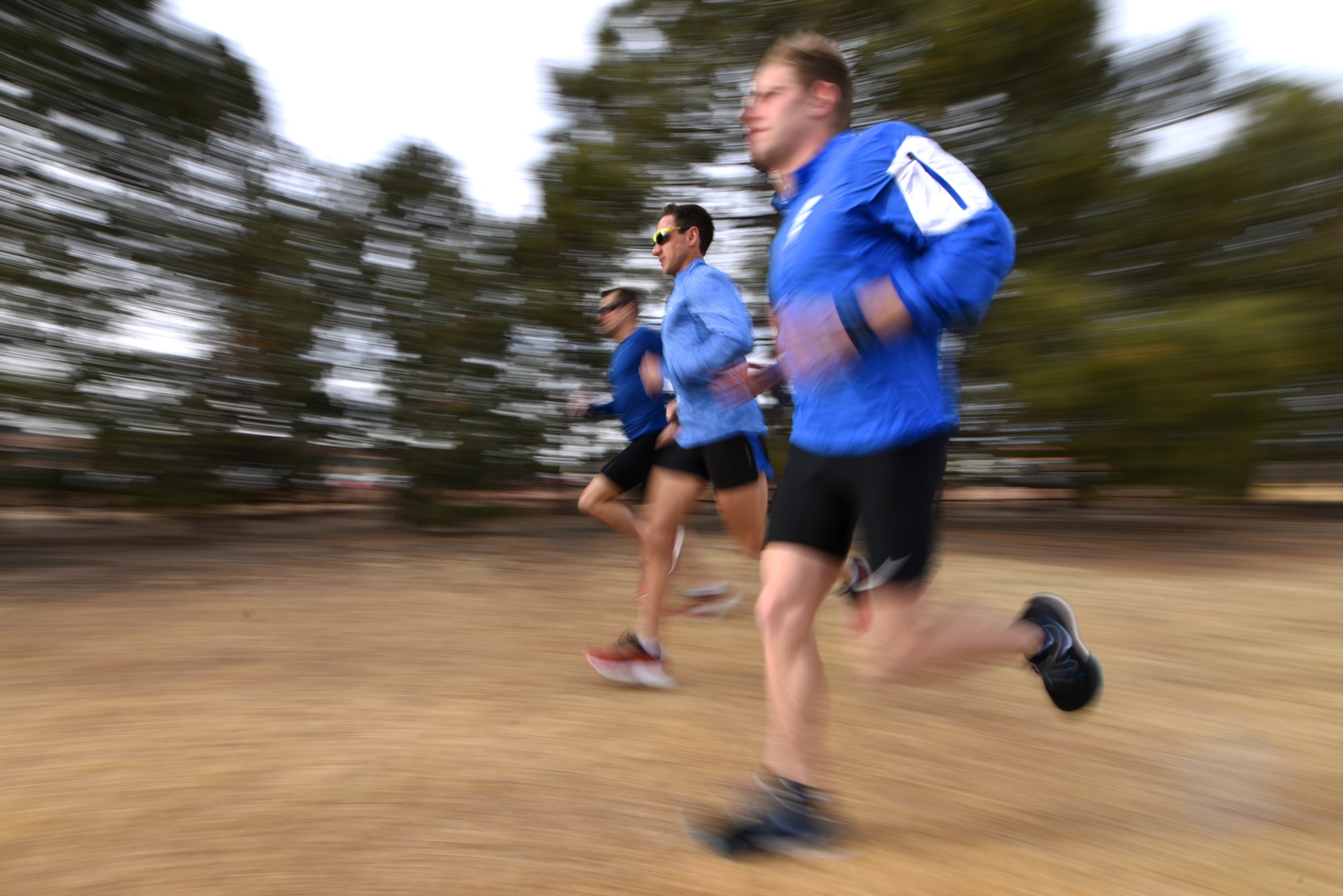 PETERSON AIR FORCE BASE, Colo. – Maj. Ben Payne, 200th Airlift Squadron C-21 pilot (center), runs alongside Capt. Matthew Williams, 21st Medical Operations Squadron physical therapist (left), and Lt. Riley Coats, 21st Force Support Squadron personnel officer (right), at Peterson Air Force Base, Colo., Feb. 27, 2017. All three run between 80 to 90 miles a week. (U.S. Air Force photo by Airman 1st Class Dennis Hoffman)