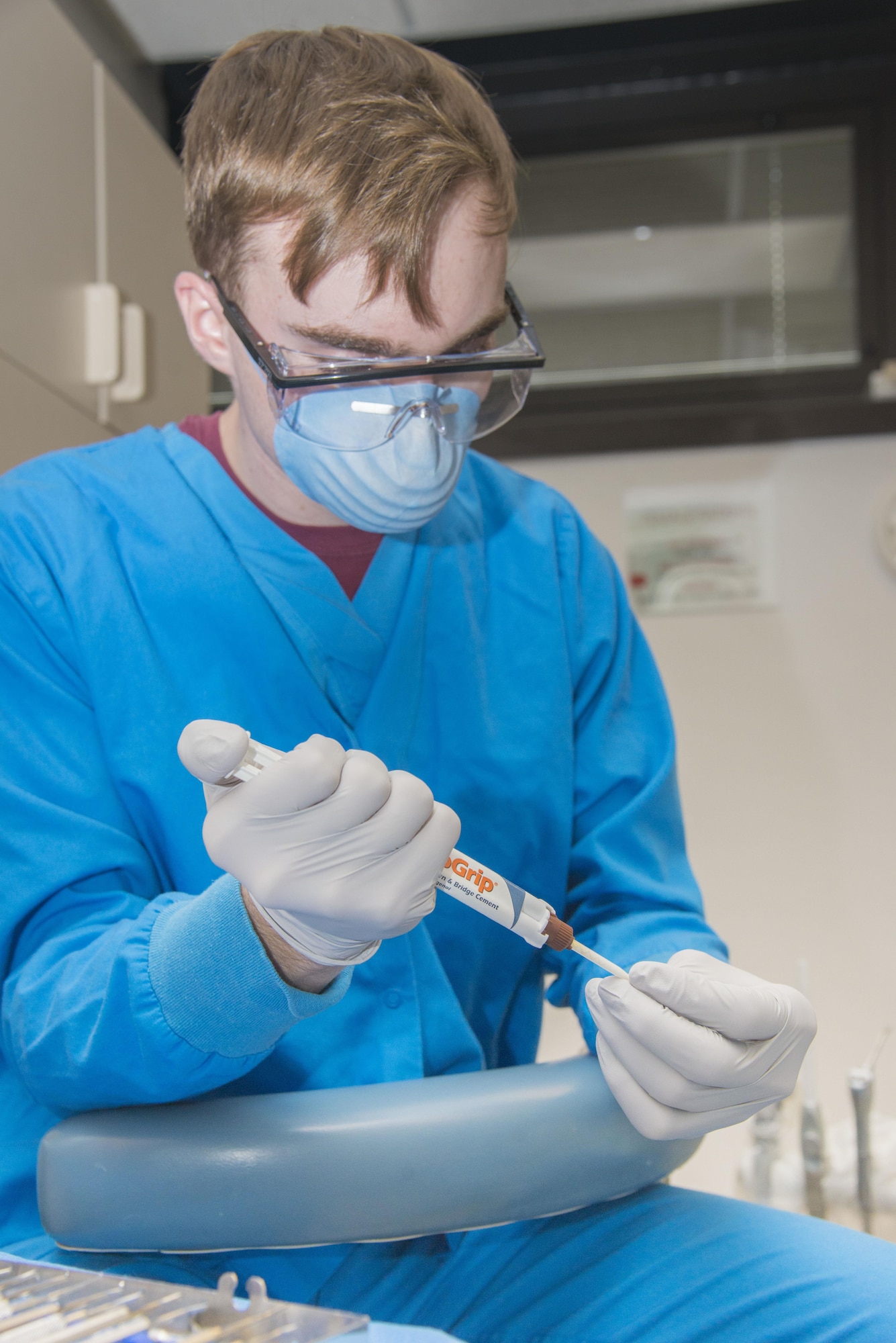 Senior Airman Bryan Henry, 436th Aerospace Medicine Squadron dental flight dental technician, prepares a temporary tooth for a patient March 3, 2017, at Dover Air Force Base, Del. During the award period, the clinic ensured 99.5% of the base's active duty population was cleared to deploy. (U.S. Air Force photo by Staff Sgt. Jared Duhon) 