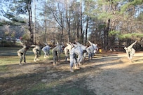 Command Sergeant Major of the 3rd Medical Command Deployment Support in Forest Park, Georgia, Robert Boudnik, conducts conditioning drills with soldiers from the 3rd Medical Command and Army Reserve Medical Command at the 2017 Joint Division Best Warrior Competition in Fort Benning, Georgia following the obstacle course on the final day of competition.