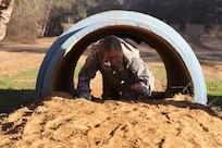 3rd Medical Command Deployment Support 2017 Enlisted Best Warrior, Specialist Katie Nadeau, a combat medic from the 804th Medical Brigade in Devens Reserve Forces Training Area, Massachusetts negotiates an obstacle at the joint division Best Warrior Competition in Fort Benning, Georgia.