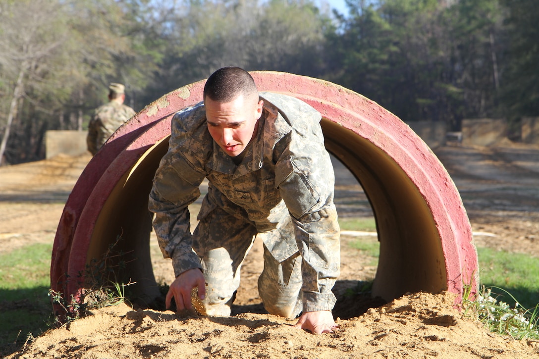 3rd Medical Command Deployment Support 2017 Noncommissioned Officer Best Warrior, Corporal Carlo DelDonno a combat medic from the 804th Medical Brigade in Devens Reserve Forces Training Area, Massachusetts negotiates an obstacle at the joint division Best Warrior Competition in Fort Benning, Georgia.
