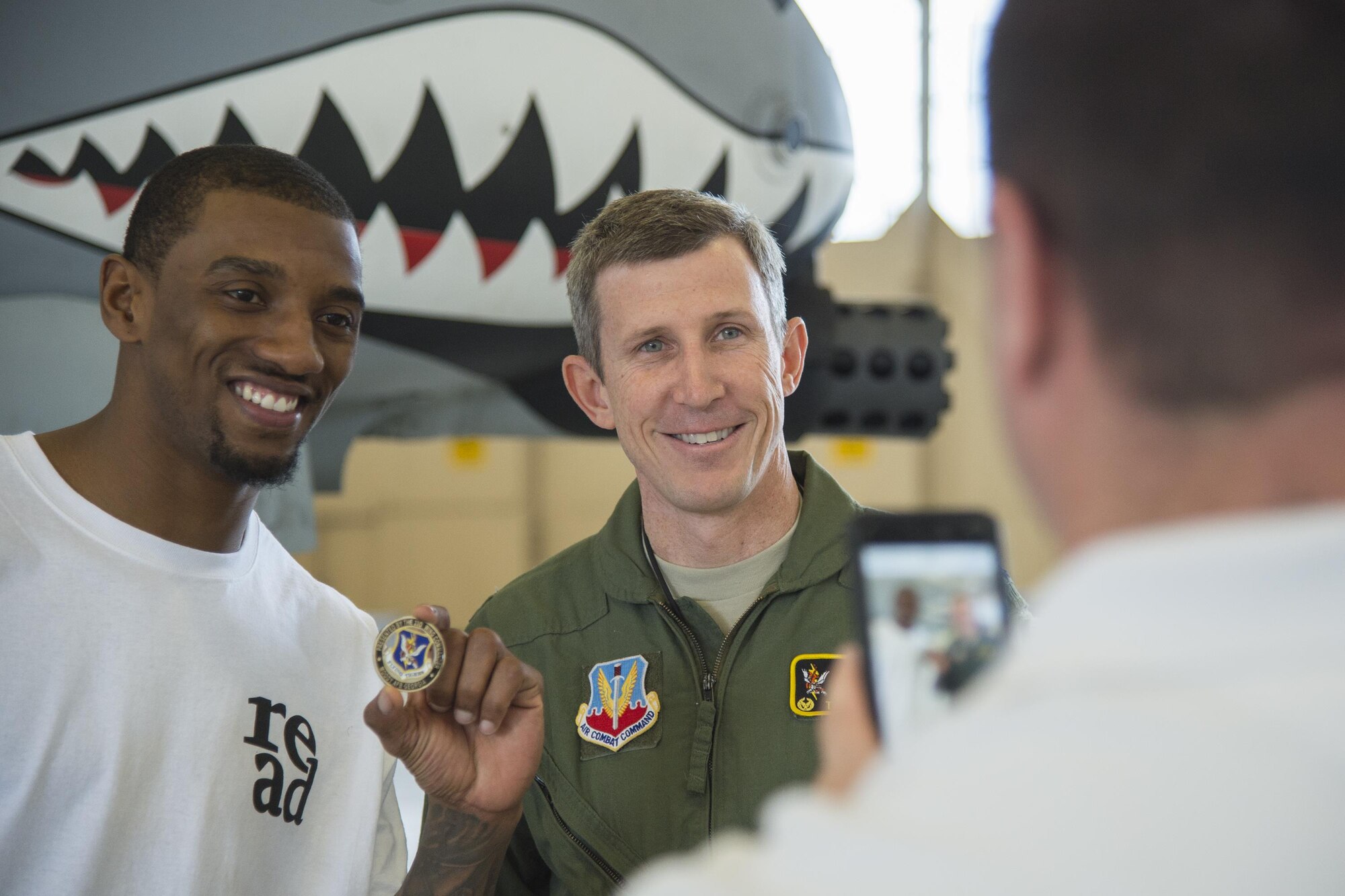 Malcolm Mitchell, left, New England Patriots’ wide receiver and Super Bowl LI Champion, and Col. Thomas Kunkel, 23d Wing commander, pose for a photo during his visit March 7, 2017, at Moody Air Force Base, Ga. Mitchell, a Valdosta native, got a glimpse of a typical day in the life of Moody Airmen. Mitchell also spent time with Airmen and signed autographs for local Patriots’ fans during his visit. (U.S. Air Force photo by Senior Airman Ceaira Young)