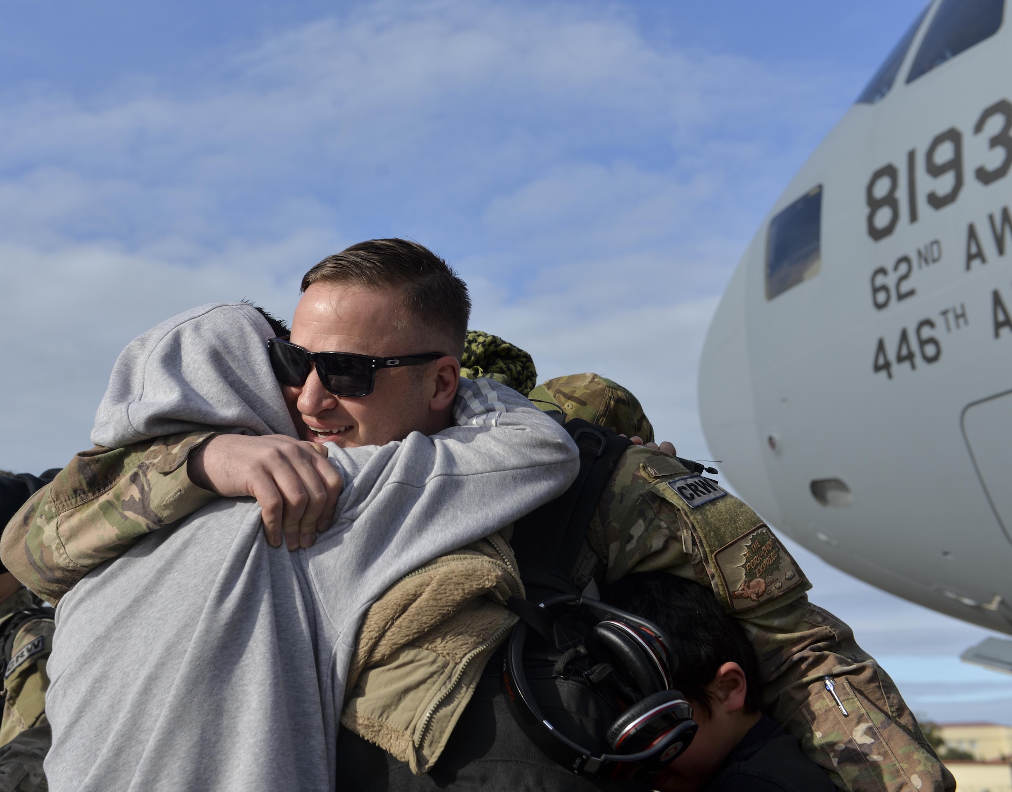 An Airman from the 621st Contingency Response Wing is welcomed home by his family at Travis Air Force Base, Calif., upon completing a four-month deployment in support of Operation Inherent Resolve, March 7, 2017. The 621st CRW—America’s only CRW—is a unique, bi-coastal unit whose forces are primarily stationed at both Travis AFB and Joint Base McGuire-Dix-Lakehurst, N.J. The 621st CRW consists of approximately 1,500 Airmen assigned to three groups, 11 squadrons and more than 20 geographically-separated operating locations aligned with major Army and Marine Corps combat units. (U.S. Air Force photo by Master Sgt. Joseph Swafford)