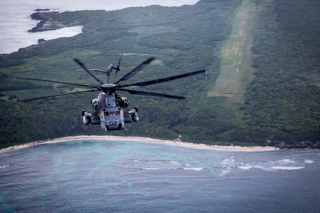 Two CH-53E helicopters from SPMAGTF-SC make the flight from Honduras to Haiti as part of the Hurricane Matthew response bypassing a lonely island on the otherwise empty route over the Caribbean Sea, October 4, 2016. The helicopters, crew and maintainers, along with other SPMAGTF-SC Marines, supported humanitarian assistance operations in Haiti for two weeks until follow-on forces arrived. A detachment from Marine Heavy Helicopter Squadron 772, Marine Aircraft Group 49, 4th Marine Aircraft Wing, formed the task force's aviation element. (U.S. Marine Corps photo by SSgt Derek Torrellas) 