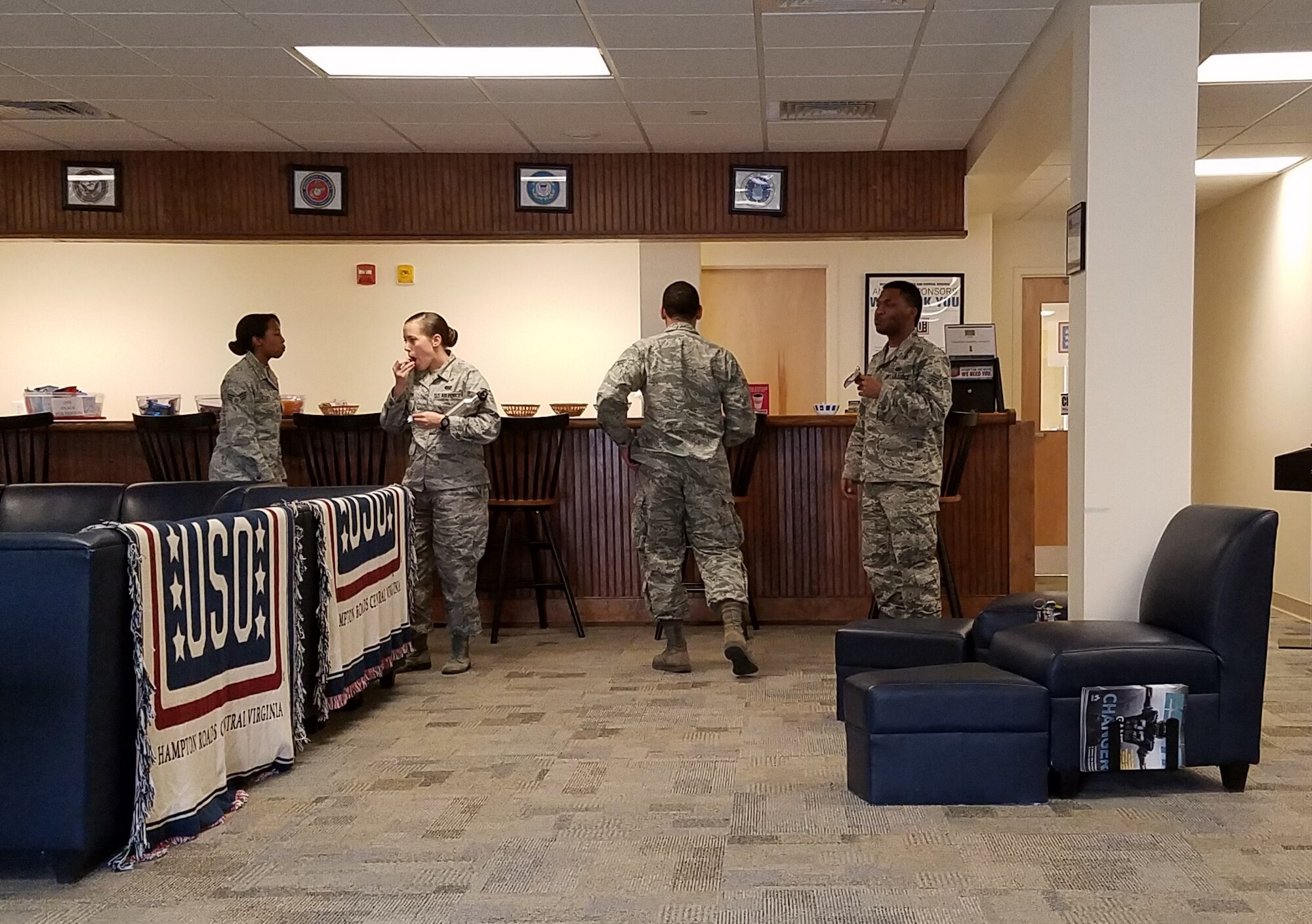 U.S. Air Force Airman Leadership School students eat snacks at the USO’s multipurpose activity room at Joint Base Langley-Eustis, Va., Feb. 28, 2017. The USO centers are staffed by volunteers who provide service members with recreational activities and programs to help maintain communication with their families. Founded in 1941 as a nonprofit organization, the USO’s mission is to strengthen America’s military service members by keeping them connected to family, home and country, throughout their service to the nation. (U. S. Air Force photo by Beverly Joyner)