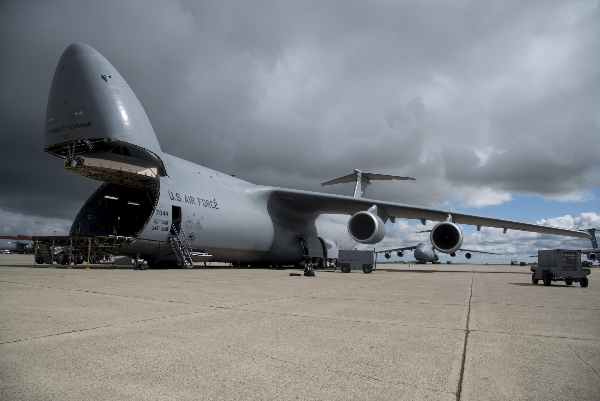 A C-5M Super Galaxy, assigned to the 22nd Airlift Squadron at Travis Air Force Base, California, sits on the ramp prior to a flight to Yokota Air Base, Japan for what's known as a PAC Channel mission March 4, 2017. Since the C-5M upgrade, the aircraft is able to fly direct to Yokota AB without the need to be refueled or make a stop in Hawaii or Alaska. (U.S. Air Force photo/Staff Sgt. Nicole Leidhom)