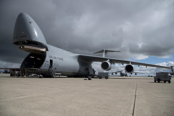A C-5M Super Galaxy, assigned to the 22nd Airlift Squadron at Travis Air Force Base, California, sits on the ramp prior to a flight to Yokota Air Base, Japan for what's known as a PAC Channel mission March 4, 2017. Since the C-5M upgrade, the aircraft is able to fly direct to Yokota AB without the need to be refueled or make a stop in Hawaii or Alaska. (U.S. Air Force photo/Staff Sgt. Nicole Leidhom)