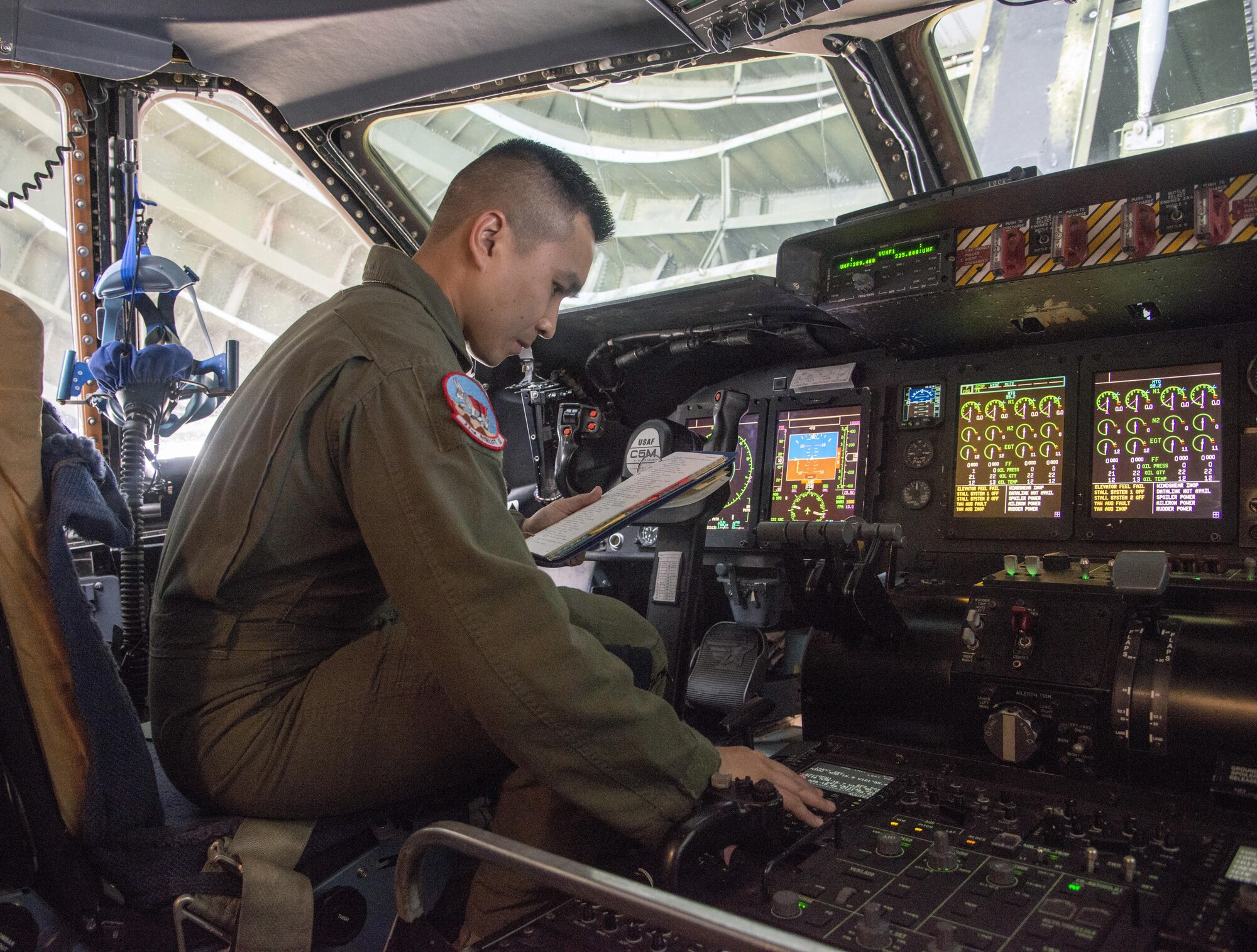 Staff Sgt. Piere Manivong, 22nd AS, completes a pre-flight inspection of the flight controls prior to a flight to Yokota Air Base, Japan March 4, 2017. As a flight engineer, it is Manivong's job is to do pre-flight inspections of the aircraft prior to the pilots coming on board the aircraft to make sure everything is safe for the flight. (U.S. Air Force photo/Staff Sgt. Nicole Leidholm)