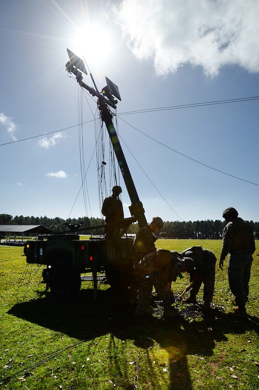 Marines with Communication Company, Headquarters Regiment, 2nd Marine Logistics Group, Camp Lejeune, N.C., take down a tactical radio aboard Marine Corps Logistics Base Albany, Ga., Feb. 16. The Marines responded to a request for assistance after an EF3 tornado tore through MCLB Albany’s warehouse district knocking out power and disrupting communications, Jan. 22. 