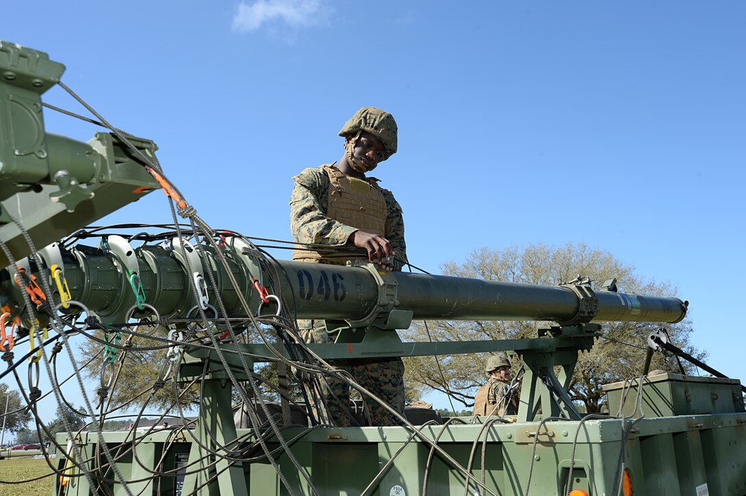 Lance Cpl. Eric J. LaRose, field radio operator, Communication Company, Headquarters Regiment, 2nd Marine Logistics Group, Camp Lejeune, N.C., secures a mast to a trailer aboard Marine Corps Logistics Base Albany, Ga., Feb. 16. The Marines responded to a request for assistance after an EF3 tornado tore through MCLB Albany’s warehouse district knocking out power and disrupting communications, Jan. 22. 