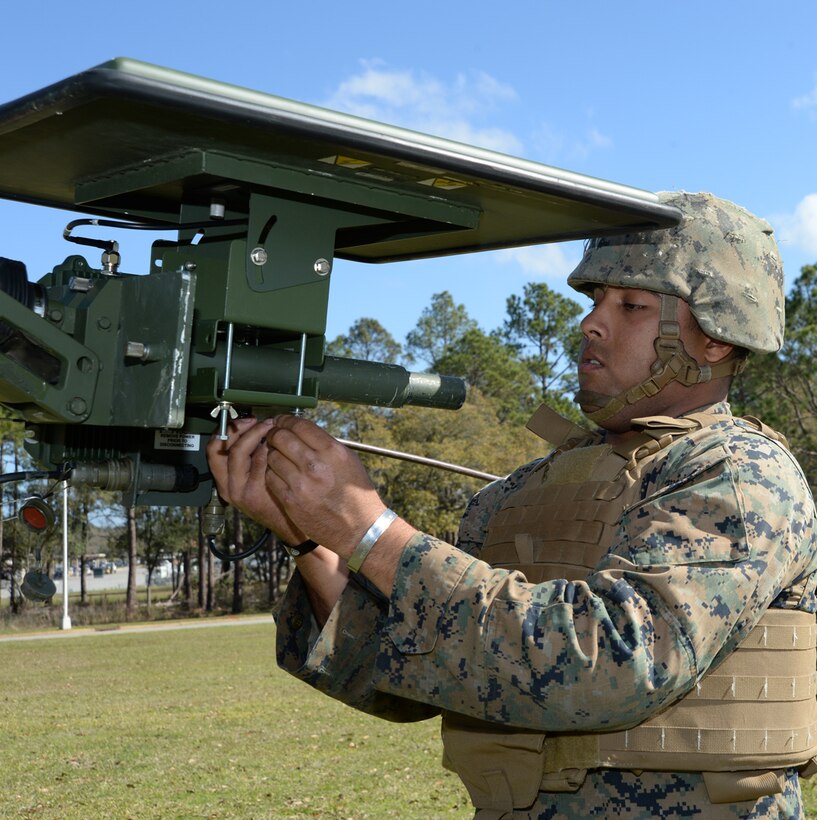 Cpl. Jonathan N. Gonzalez, multichannel radio operator, Communication Company, Headquarters Regiment, 2nd Marine Logistics Group, Camp Lejeune, N.C., dissembles tactical radio from a mast aboard Marine Corps Logistics Base Albany, Ga., Feb. 16. The Marines responded to a request for assistance after an EF3 tornado tore through MCLB Albany’s warehouse district knocking out power and disrupting communications, Jan. 22. 