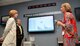 Dana Stanley, Air Logisitics Complex Director of Staff, and Chris Welchel, ALC Readiness chief, listen to Virginia Dyer, ALC Personnel Security lead, as she discusses some of the charted process review within the 