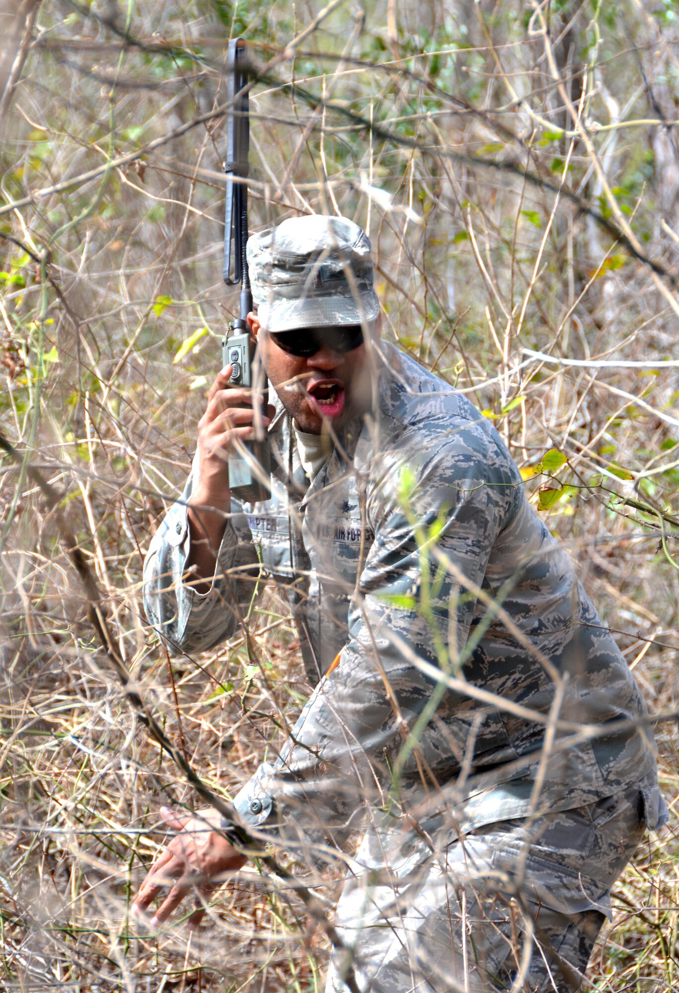 Second Lieutenant Steven Sumpter, 729th Air Control Squadron, Hill Air Force Base, Utah, radios in coordinates during a land navigation exercise provided by the 5th Combat Communications Group on Robins Air Force Base, Ga., March 2, 2017. The 5th CCG provides a two-week course for a maximum of 34 students and cover a variety of topics such as land navigation, improvised explosive device detection, and much more. (U.S. Air Force photo by Tech. Sgt. Kelly Goonan/released)