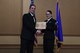 Petty Officer 2nd Class Samantha Hamilton, funeral honors department coordinator with the Naval Operational Center Pittsburgh, receives and award from Chief Christopher Degothseir, command chief  of NOSC Pittsburgh, at the 911th Airlift Wing Awards Banquet, Coraopolis, Pennsylvania, March 4, 2017. This marked the first year members of NOSC Pittsburgh were recognized alongside members of the 911th AW.