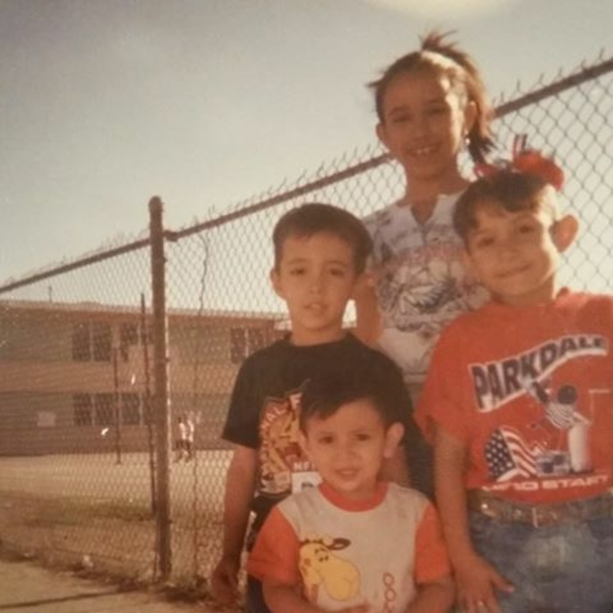 U.S. Air Force Airman 1st Class Alicia “Alice” Contreras, center, 7th Bomb Wing paralegal, with her siblings while she was in the second grade. During her early elementary years, Contreras and her siblings had to regularly get ready for school at 3 a.m. so they could take an array of buses to continue to attend school in the U.S. after her family was forced to move to Mexico following her mother’s divorce. (Courtesy photo)