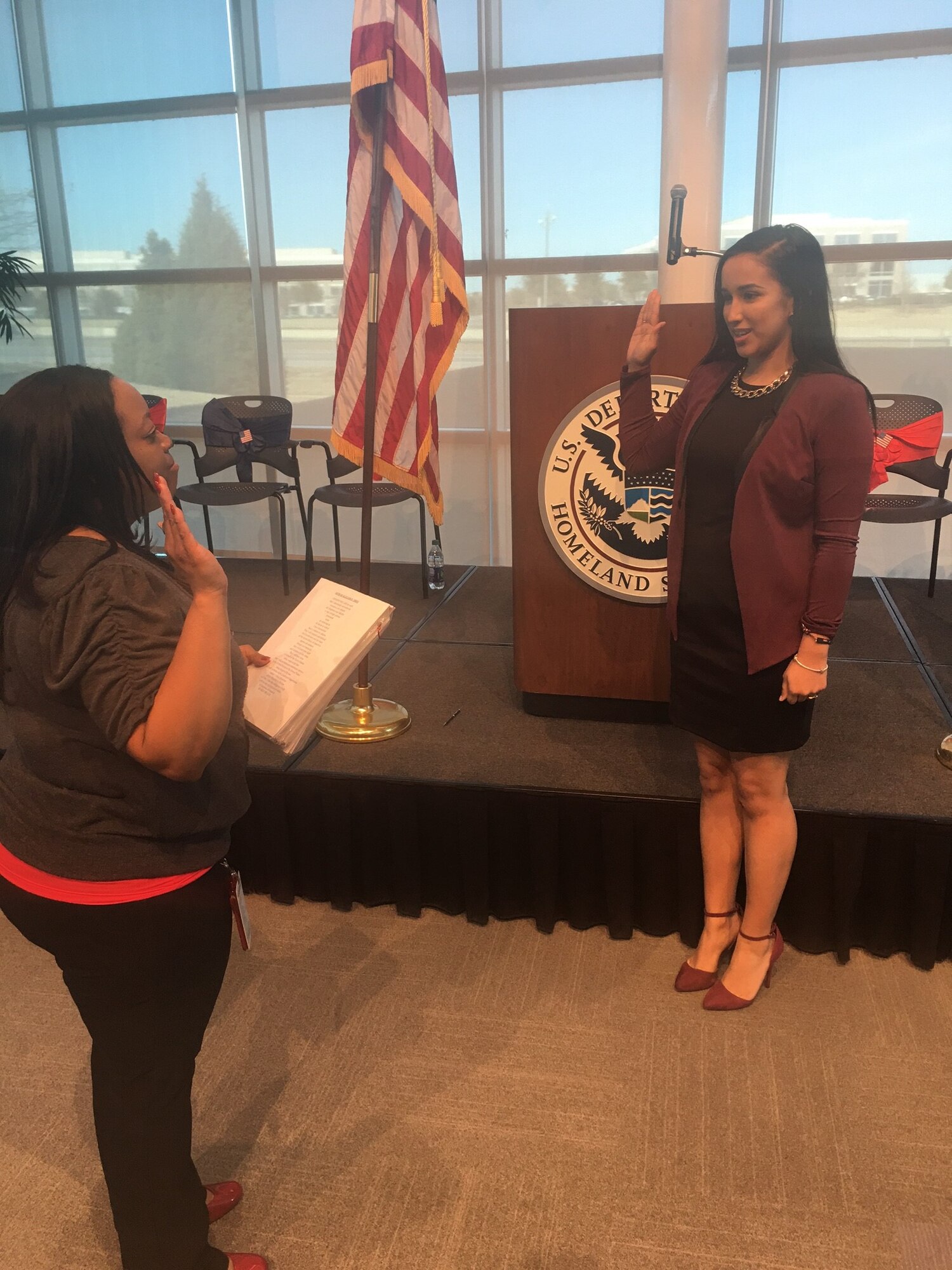 U.S. Air Force Airman 1st Class Alicia “Alice” Contreras, right, 7th Bomb Wing paralegal, recites the oath of citizenship at the department of citizenship and immigration services in Dallas, Texas, Feb. 7, 2017. After almost two years since joining the U.S. Air Force, Contreras was finally able to achieve one of her biggest goals: obtaining American citizenship. (Courtesy photo)