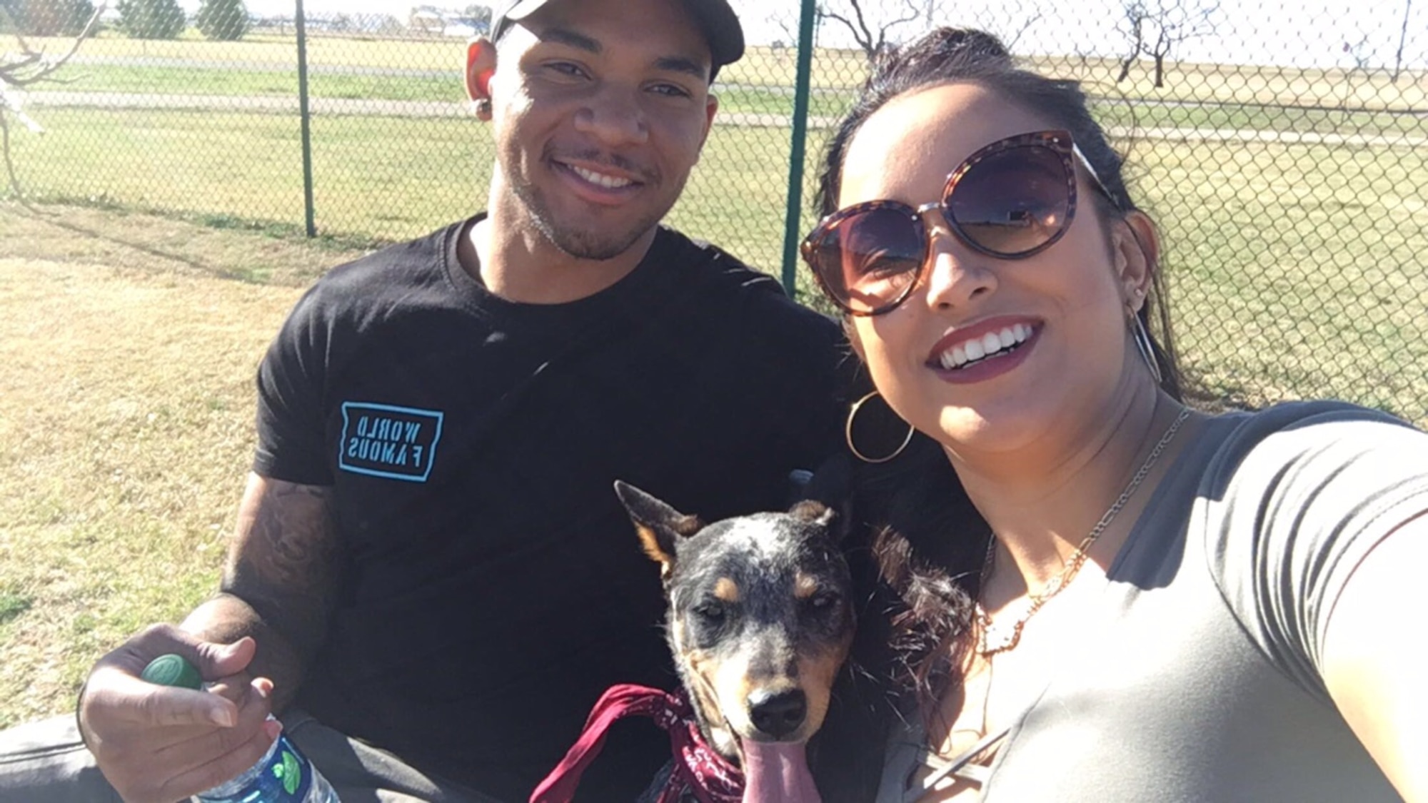 U.S. Air Force Senior Airman Bryant Simmons, left, 7th Security Forces Squadron member, and U.S. Air Force Airman 1st Class Alicia “Alice” Contreras, 7th Bomb Wing paralegal, with their dog, Zoey. Contreras says that Simmons and Zoey are the biggest supporters in gaining her citizenship, which she officially gained Feb. 7, 2017. (Courtesy photo)