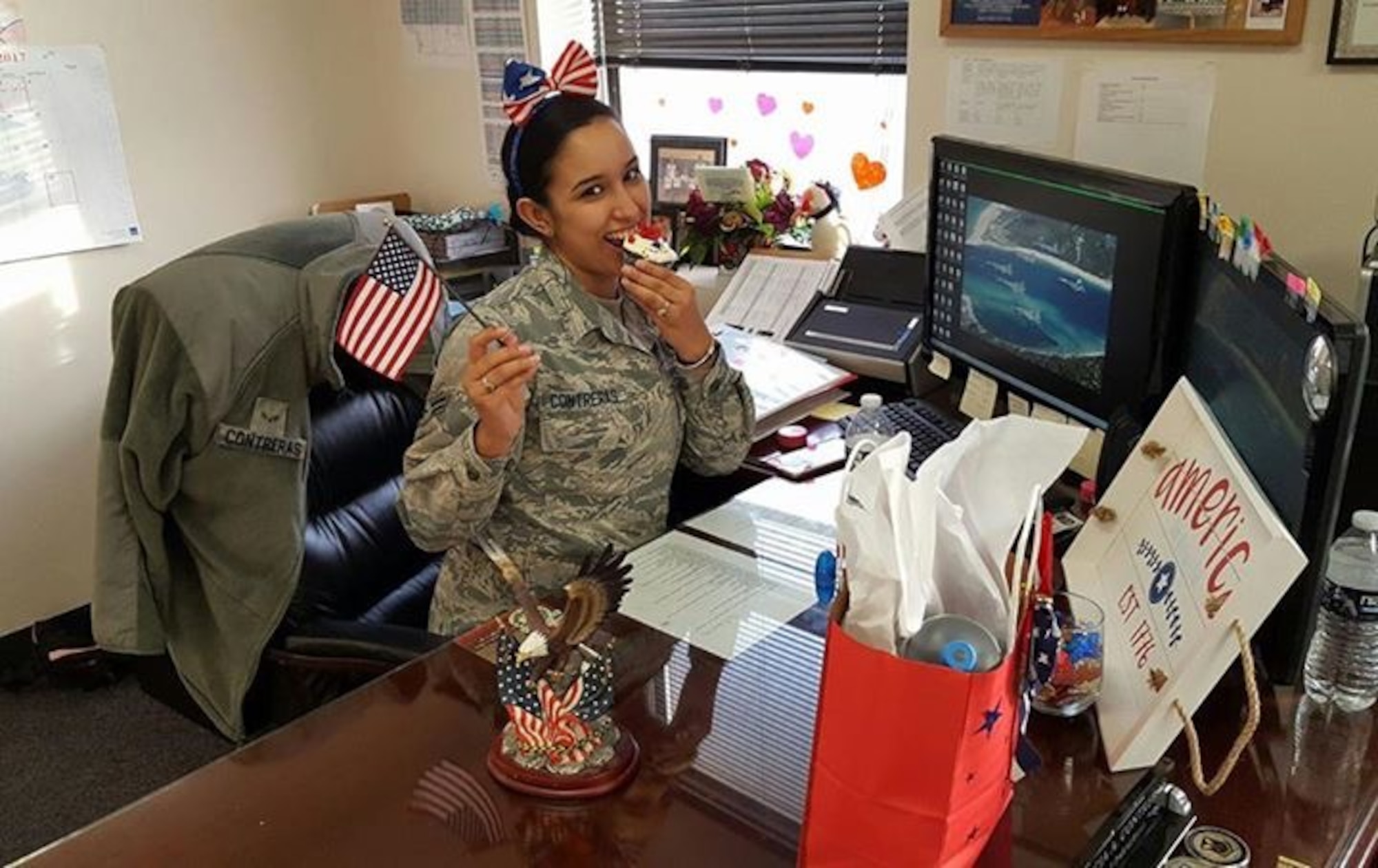 U.S. Air Force Airman 1st Class Alicia “Alice” Contreras, 7th Bomb Wing paralegal gained U.S. citizenship Feb. 7, 2017. When she returned to work, Contreras found that her coworkers had decorated her desk with “Americana” decorations to celebrate her accomplishment and dedication to earning it. (Courtesy photo)