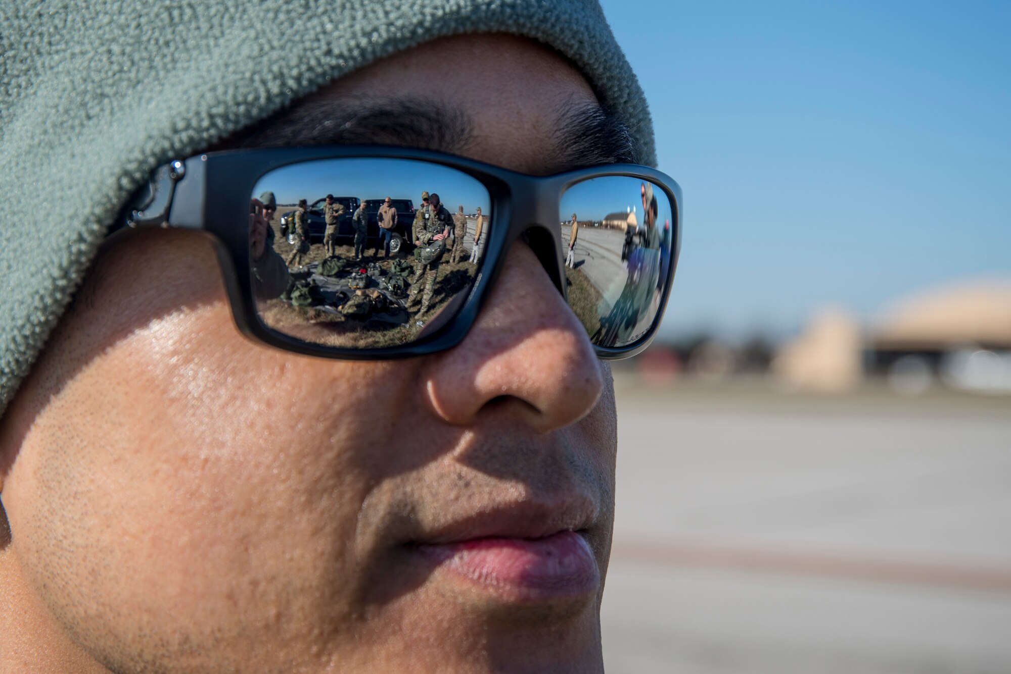 Maj. Ray Mamuad, 375th Operational Support Squadron aircrew flight equipment flight commander, observes as members of the 375th OSS Survival, Evasion, Resistance and Escape unit as well as the 19th OSS prepare for the first ever personnel drop onto the drop zone at Scott Air Force Base, Illinois March 2, 2017. The drop zone is a new addition to the airfield enhancing capabilities to conduct a diverse set of operations. (U.S.Air Force Photo by Airman 1st Class Daniel Garcia)