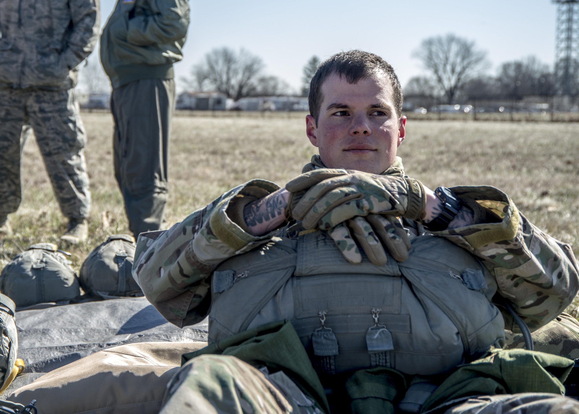 Staff Sgt. Sam Neitzer, 375th Operational Support Squadron Survival, Evasion, Resistance and Escape specialist, awaits the arrival of a from a Lockheed C-130 Hercules to participate in the first ever personnel drop onto the drop zone at Scott Air Force Base, Illinois March 2, 2017. The drop zone is a new addition to the airfield enhancing capabilities to conduct a diverse set of operations. (U.S.Air Force Photo by Airman 1st Class Daniel Garcia)