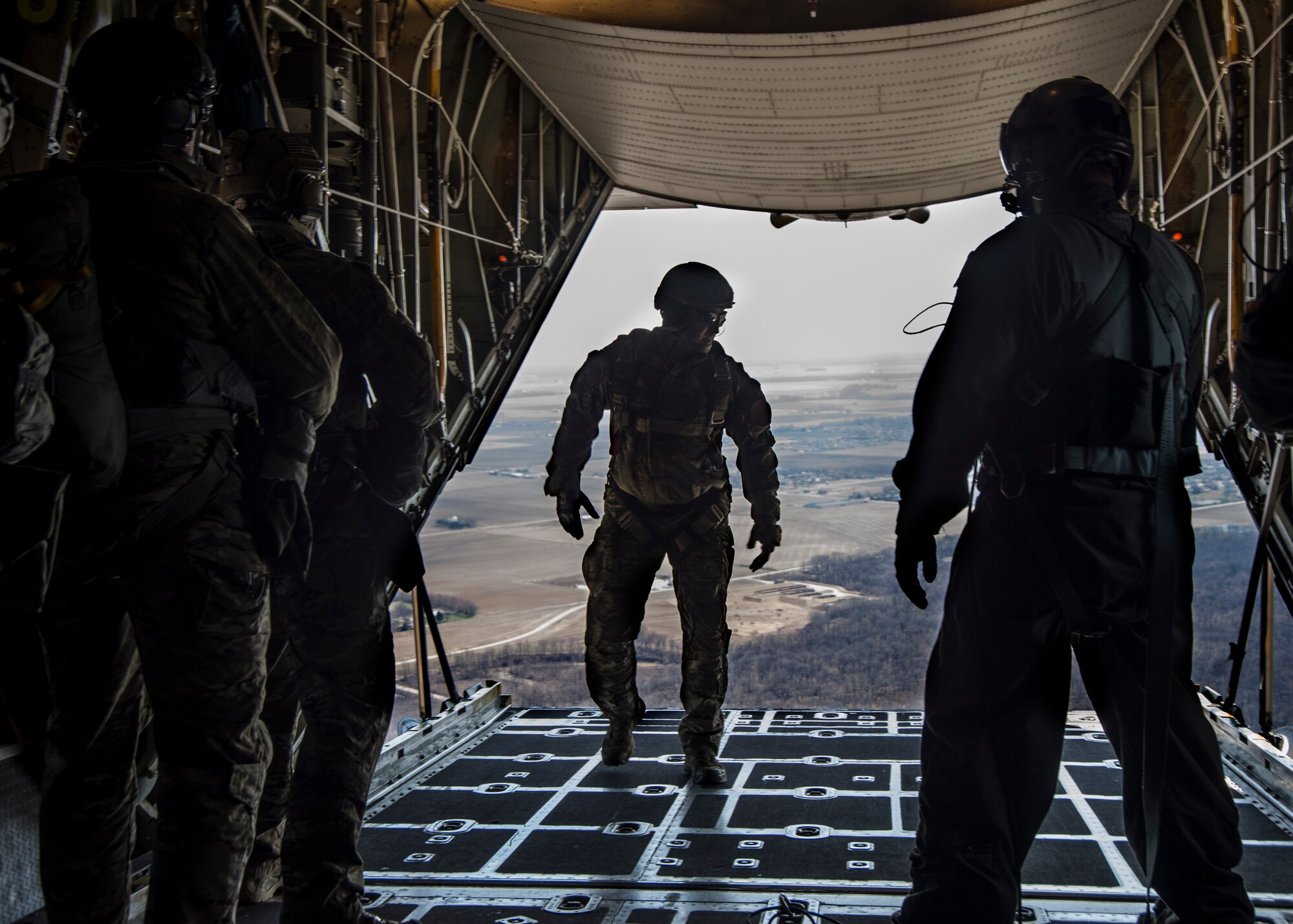 Master Sgt. Ed Dewejko, 19th Operational Support Squadron Survival, Evasion, Resistance and Escape superintendent, prepares for a static line jump from a Lockheed C-130 Hercules above the drop zone at Scott Air Force Base, Illinois March 2, 2017. The drop zone is a new addition to the airfield enhancing capabilities to conduct a diverse set of operations. (U.S.Air Force Photo by Airman 1st Class Daniel Garcia)