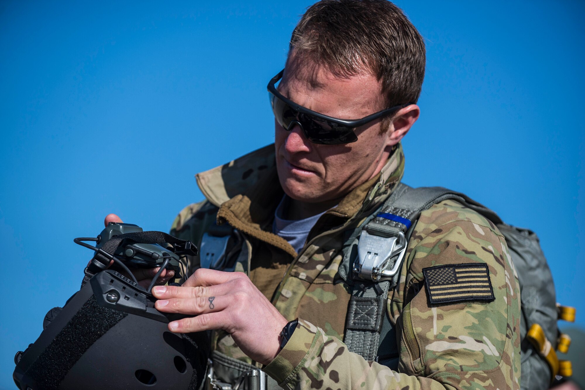 Tech. Sgt. Kyle Oler, 375th Operations Support Squadron's Survival, Evasion, Resistance, and Escape non commissioned officer in charge, prepares for a static jump on March 2, 2017 at Scott AFB, Illinois. Scott AFB hosted this jump to streamline its capabilities and jump program while offering jumpers an opportunity to get required jumps accomplished as they face weather challenges elsewhere. The 375th OSS created the drop zone to increase the readiness of units in and around Scott AFB and for use by flying or ground units with an interest and the requirements. (U.S. Air Force photos/Senior Airman Tristin English)