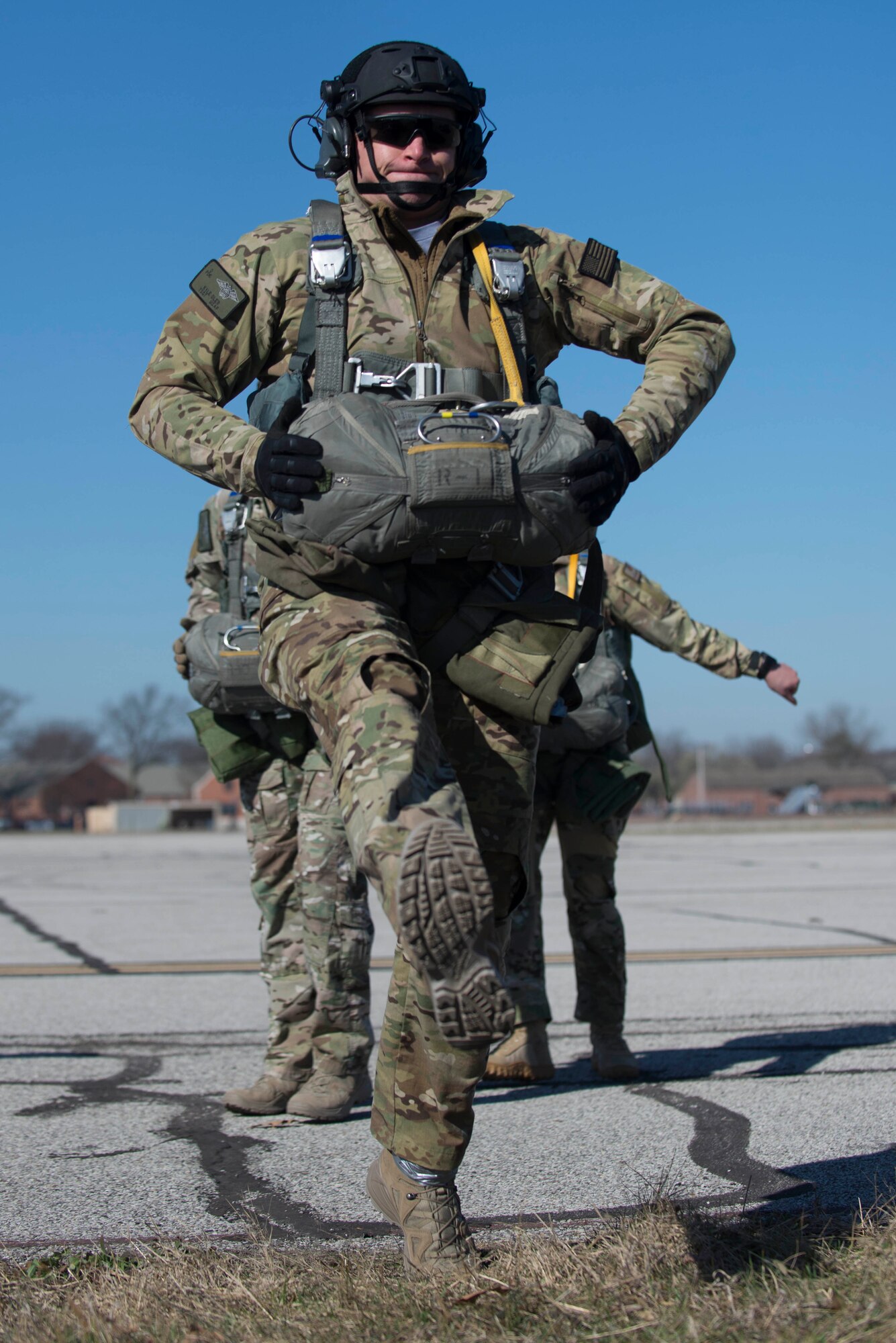Tech. Sgt. Kyle Oler, 375th Operations Support Squadron's Survival, Evasion, Resistance, and Escape non commissioned officer in charge, practices his jump before performing a static jump on March 2, 2017 at Scott AFB, Illinois. Scott AFB hosted this jump to streamline its capabilities and jump program while offering jumpers an opportunity to get required jumps accomplished as they face weather challenges elsewhere. The 375th OSS created the drop zone to increase the readiness of units in and around Scott AFB and for use by flying or ground units with an interest and the requirements. (U.S. Air Force photos/Senior Airman Tristin English)
