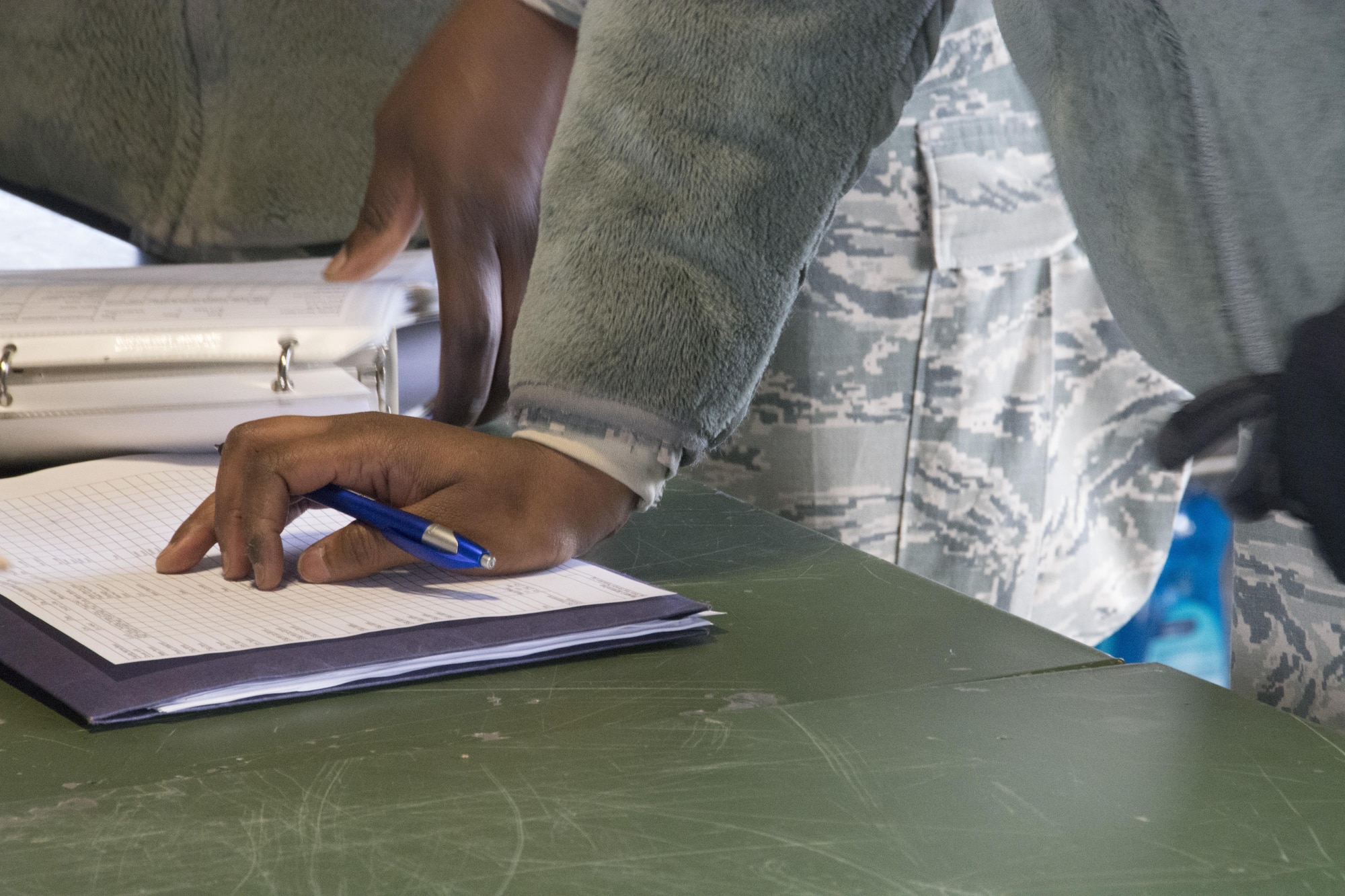 Staff Sgt. Mercedes, food services specialist, 512th Memorial Affairs Squadron, logs food temperatures while competing for the 2017 John L. Hennessy Award at Dover Air Force Base, Del., March 3, 2017. The Hennessy Award recognizes excellence in foodservices across multiple military branches. (U.S. Air Force photo / Renee M. Jackson)