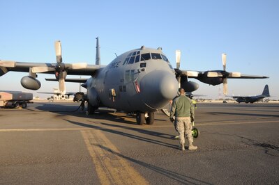 Air Force Staff Sgt. Michael Beaver, a 737th Expeditionary Air Squadron crew chief, watches over a C-130 Hercules as it is refueled at an undisclosed location in Southwest Asia, Feb. 8, 2017. The mission of the 737th is to deliver personnel and cargo downrange in support of Operation Inherent Resolve and its campaign to defeat the Islamic State of Iraq and Syria. Air Force photo by Tech. Sgt. Kenneth McCann