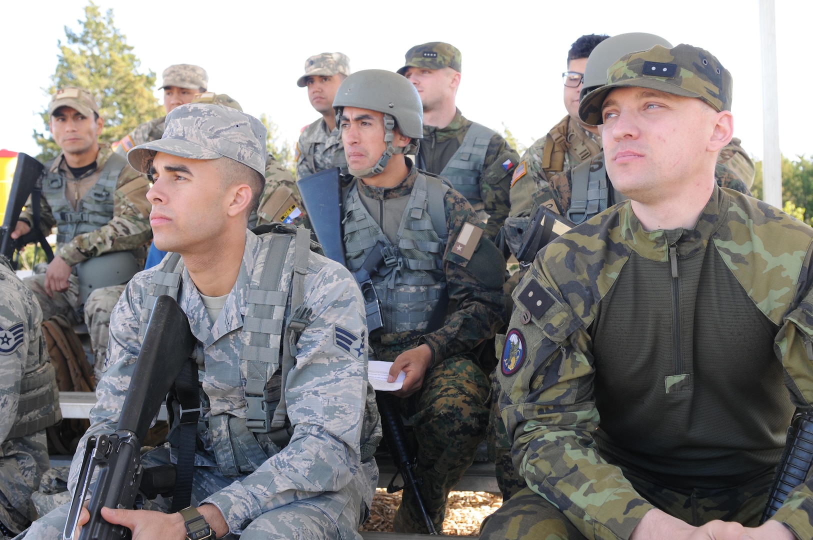 Texas National Guard Soldiers and Airmen receive a safety brief along with with Czech and Chilean service members at the M4 qualification event as part of the fifth annual Texas Military Department Best Warrior Competition, at Camp Swift near Bastrop, Texas, March 3, 2017. This year's Best Warrior Competition was the second time Chilean soldiers participated and the first time for soldiers from the Czech Republic as part of Texas Military Department's initiative to develop relations with foreign partners. 