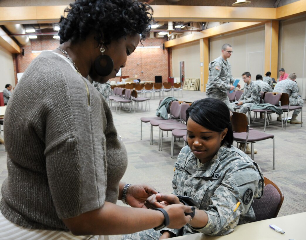 Sgt. 1st Class Miranda Toussaint, a finance instructor with the U.S. Army Reserve’s 8th Battalion, 98th Regiment, has her blood pressure checked by Lisa Walls, event oversight administrator with Logistics Health Incorporated, during the 99th Regional Support Command’s Soldier Readiness Improvement Event March 4 at the Frank B. Lotts Center in Richmond, Virginia. This event was the first in the 99th RSC’s new Soldier Readiness Improvement Initiative, which offers unit commanders a one-stop shop for personnel and medical readiness that helps make Soldiers mission capable.