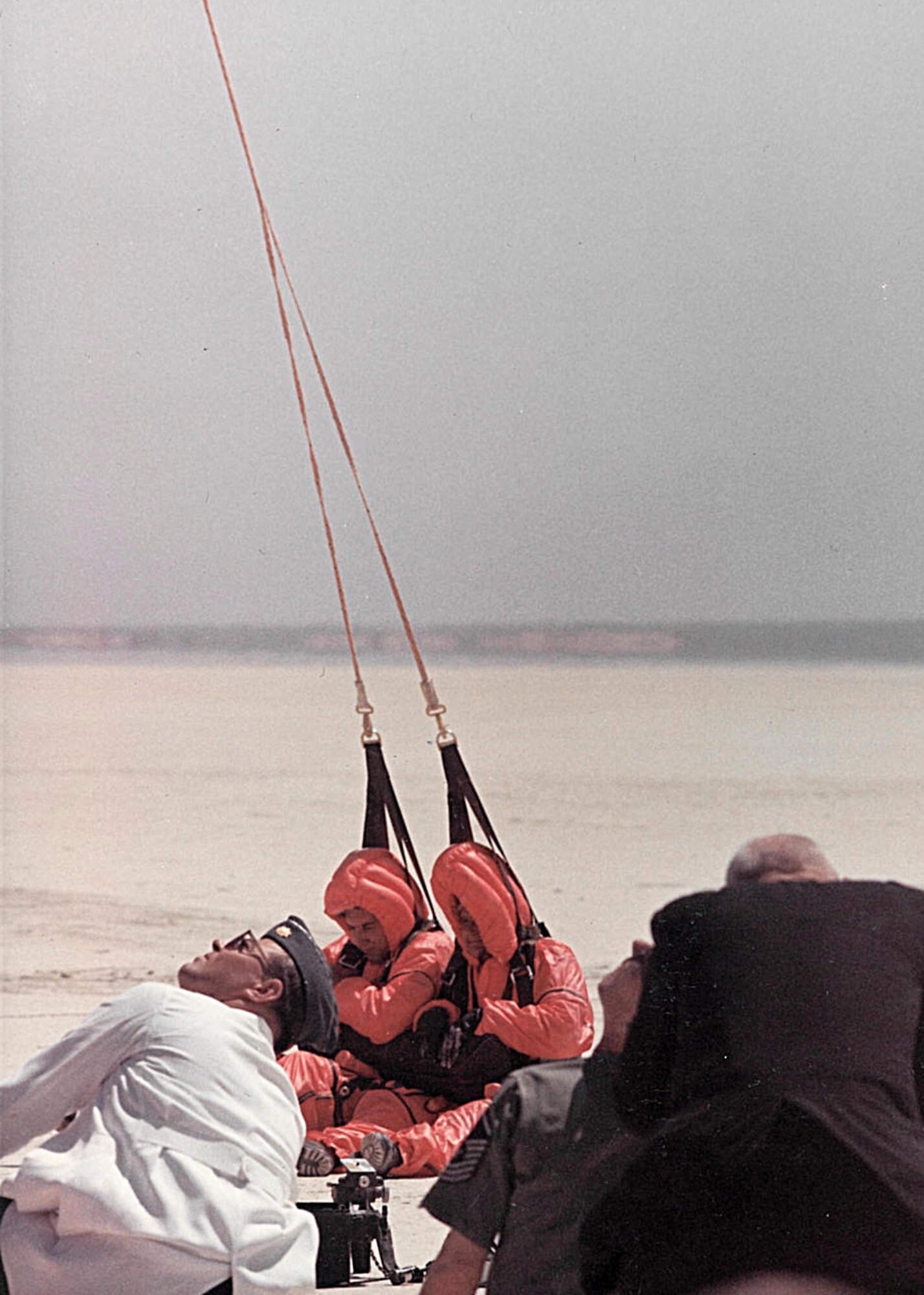 King 52 was one of a few HC-130Hs converted to conduct rescue operations in the 1960s. Pictured above is tail# 14859 conducting a Fulton Surface-To-Air Recovery System test in May 1966. The kit is dropped to a person in the water who puts on a red balloon suit with harness and is reeled aboard the plane. Recovery kits were designed for one- and two-man recoveries. (Edwards History Office photo)