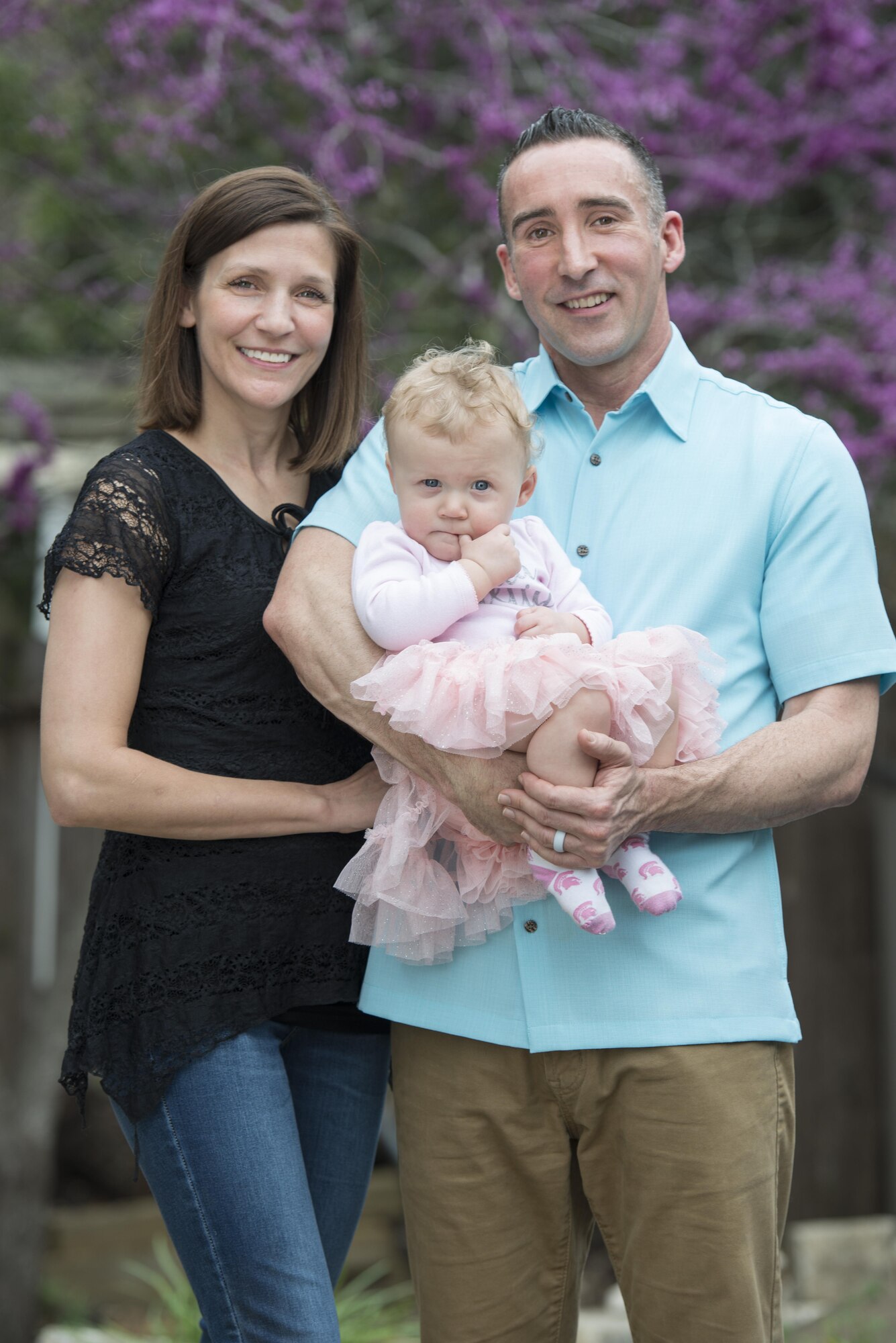 Maj.  Thomas Lessner, 39th Flying Training Squadron instructor pilot, poses for a photo with his wife Kathleen and daughter Dottie after giving a news interview February 27, 2017.  (U.S. Air Force by Sean M. Worrell)
