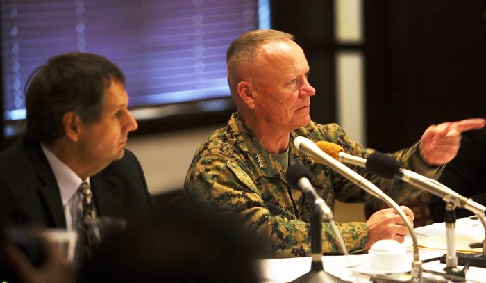 Lt. Gen. Lawrence D. Nicholson calls on an Okinawan media representative to ask a question during the media round table on March 8, 2017, at Camp Foster, Okinawa, Japan. Nicholson and U.S. Consul General Mr. Joel Ehrendreich, spoke with approximately 18 Okinawan and mainland Japan media representatives to answer questions concerning the purpose and reach of the new Okinawa Orientation Overview brief given to newcomers, the actions taken to advance the U.S. and Japanese alliance, and flight policies set in place for U.S. military aircraft operating in and around Okinawa. Nicholson, from Toronto, Canada is the commanding general for III Marine Expeditionary Force. Ehrendreich is the consul general at the U.S. Consulate, Naha. 