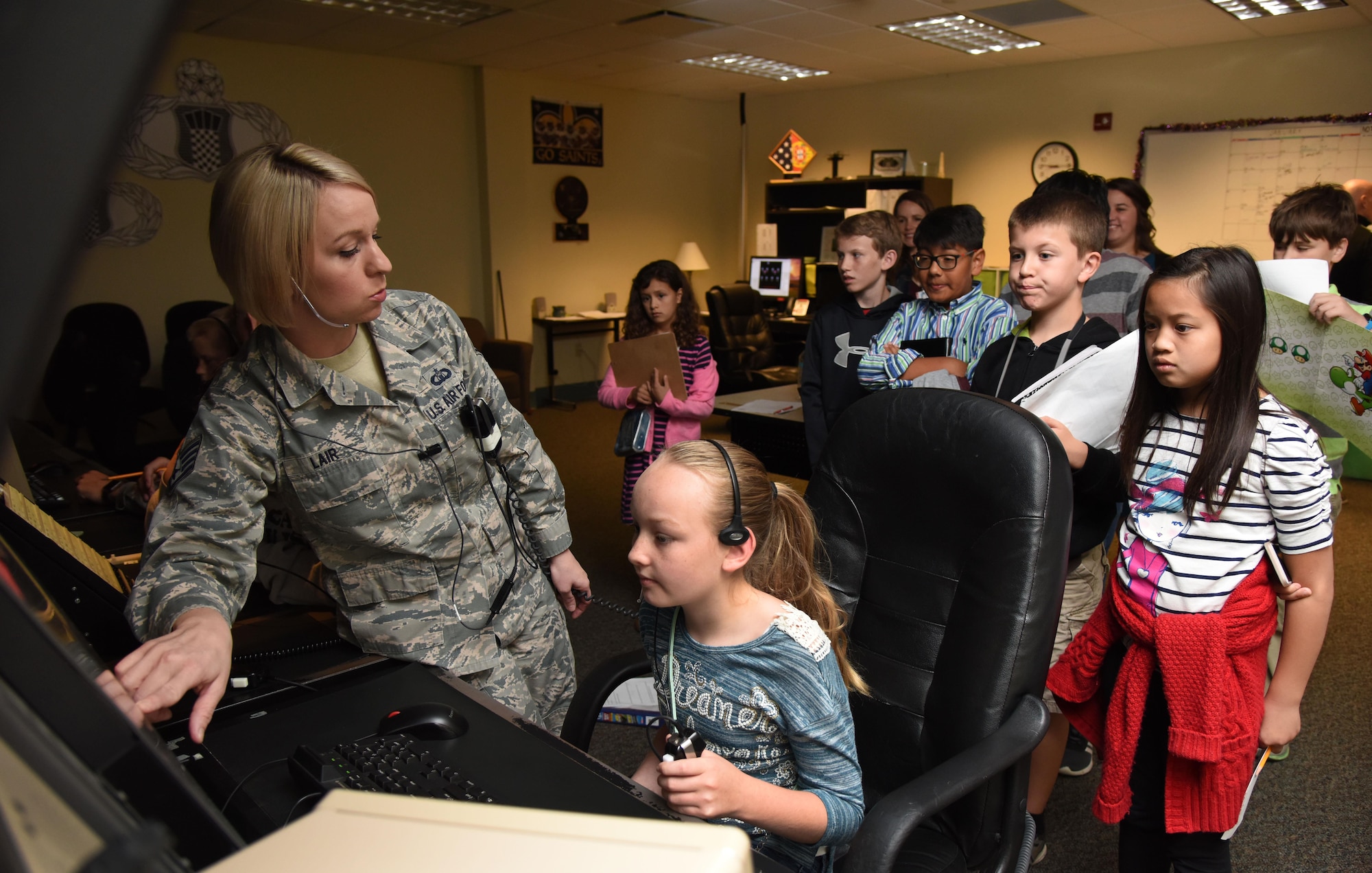 Staff Sgt. Megan Lair, 334th Training Squadron instructor, gives Biloxi school students a demonstration of an air traffic control radar simulator at Cody Hall during Biloxi Career Exploration Day March 2, 2017, on Keesler Air Force Base, Miss. The school-aged children also toured the 81st Security Forces Squadron canine facility, 335th TRS and the Keesler Fire Department. (U.S. Air Force photo by Kemberly Groue)
