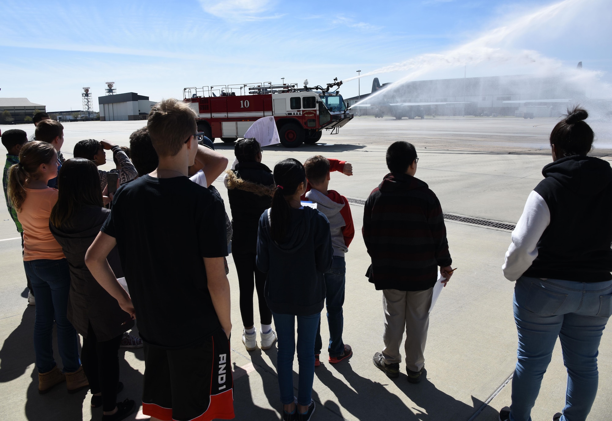 School-aged children watch a demonstration at the Keesler Fire Department during Biloxi Career Exploration Day March 2, 2017, on Keesler Air Force Base, Miss. The children also toured the 334th Training Squadron air traffic control school, 335th TRS weather facility and the 81st Security Forces Squadron canine facility. (U.S. Air Force photo by Kemberly Groue)
