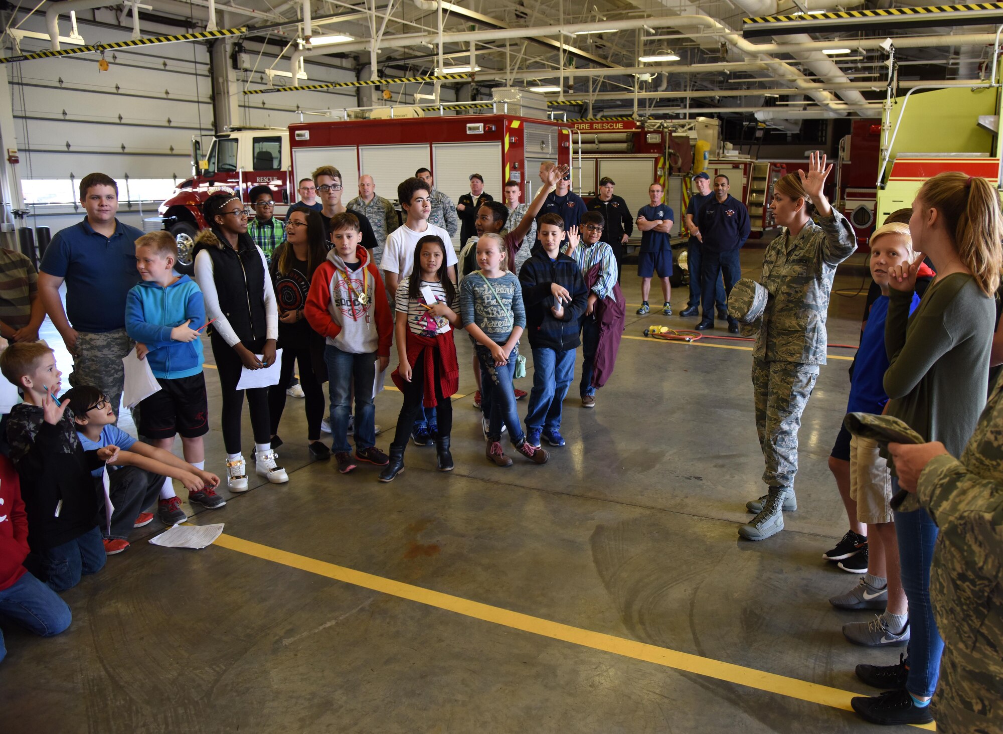Col. Michele Edmondson, 81st Training Wing commander, quizzes school-aged children about their visit to the installation during Biloxi Career Exploration Day March 2, 2017, on Keesler Air Force Base, Miss. The children also toured the 334th Training Squadron air traffic control school, 335th TRS weather facility and the 81st Security Forces Squadron canine facility. (U.S. Air Force photo by Kemberly Groue)