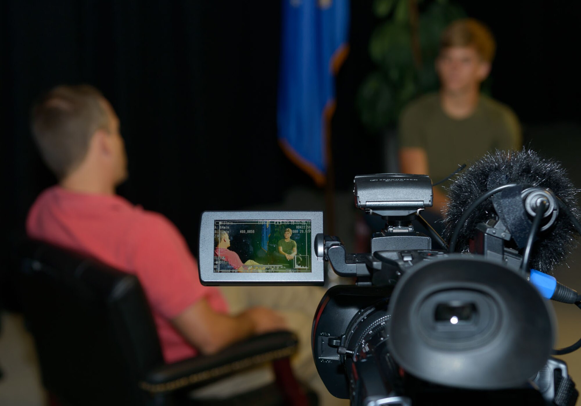Andrew Whitman, 81st Training Wing television producer and director, conducts a mock interview with Mac Smith, son of Col. C. Mike Smith, 81st TRW vice commander, during Biloxi Career Exploration Day at Wall Studio, March 2, 2017, on Keesler Air Force Base, Miss. The children shadowed their parents and 81st TRW executive officers throughout the day to get a better understanding of what they do on a day-to-day basis to complete the Air Force mission. (U.S. Air Force photo by André Askew)