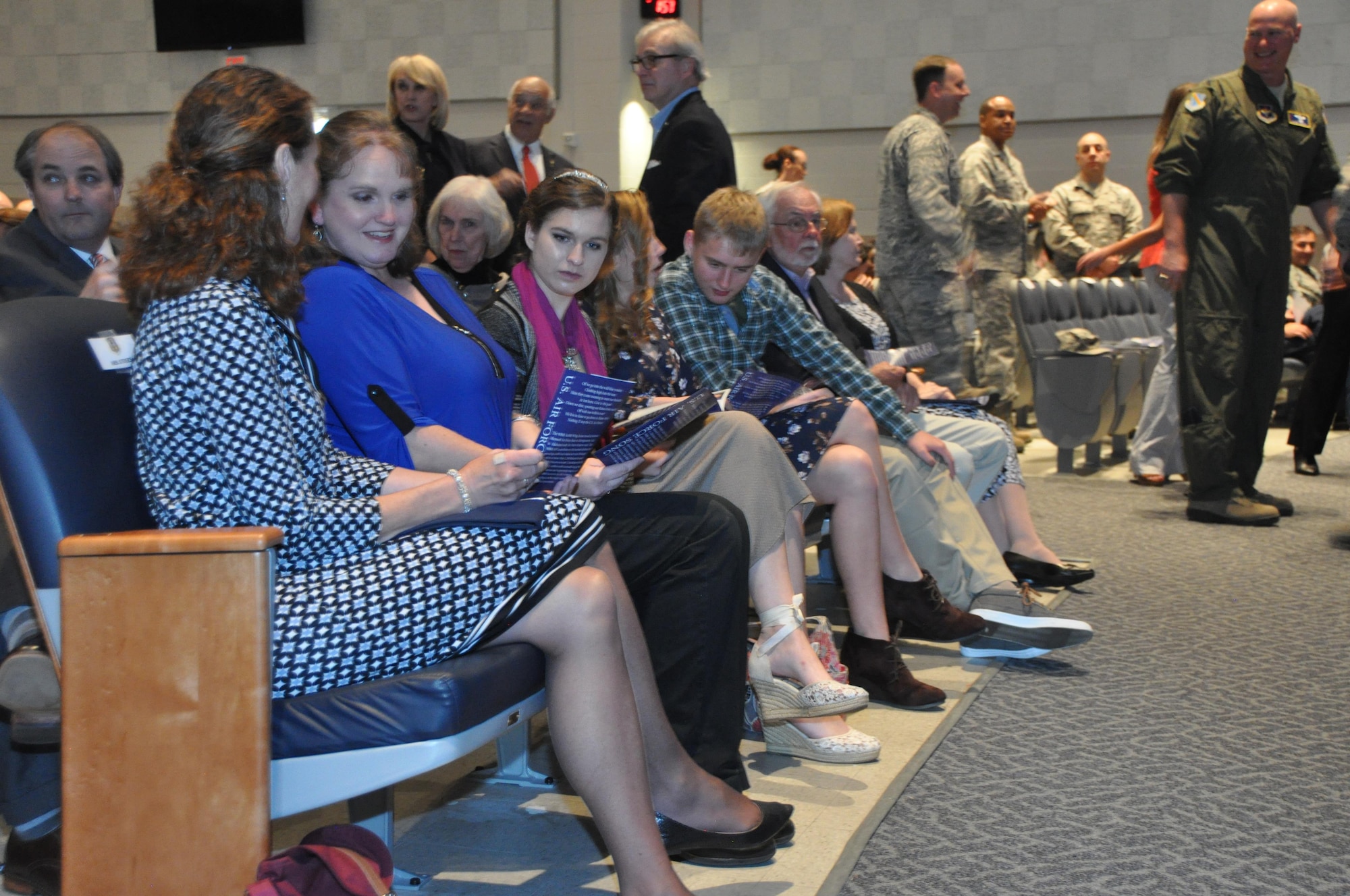 Sandy Stokes (left) wife of 22nd Air Force commander Maj. Gen. John Stokes, sits with the Ostrat family before Col. Kenneth Ostrat’s Assumption of Command ceremony March 5 at Maxwell Air Force Base. Ostrat returns to the 908th Airlift Wing after his previous stint as the director of operations of the wing’s 357th Airlift Squadron from July 2008 until December 2012. (U.S. Air Force photo by Bradley J. Clark)