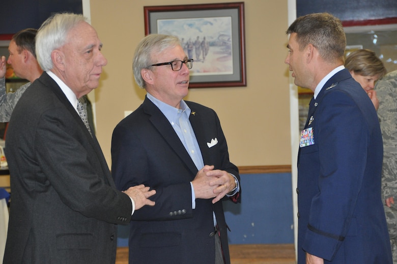 Area civic leader, Tom Albrecht (left) and retired 908th Airlift Wing Mission Support Group commander, Col. Don Brown (center) congratulate Col. Kenneth Ostrat, commander of the 908th Airlift Wing. Congratulations were in order following Ostrat’s Assumption of Command ceremony March 5 at Maxwell Air Force Base. (U.S. Air Force photo by Bradley J. Clark)
