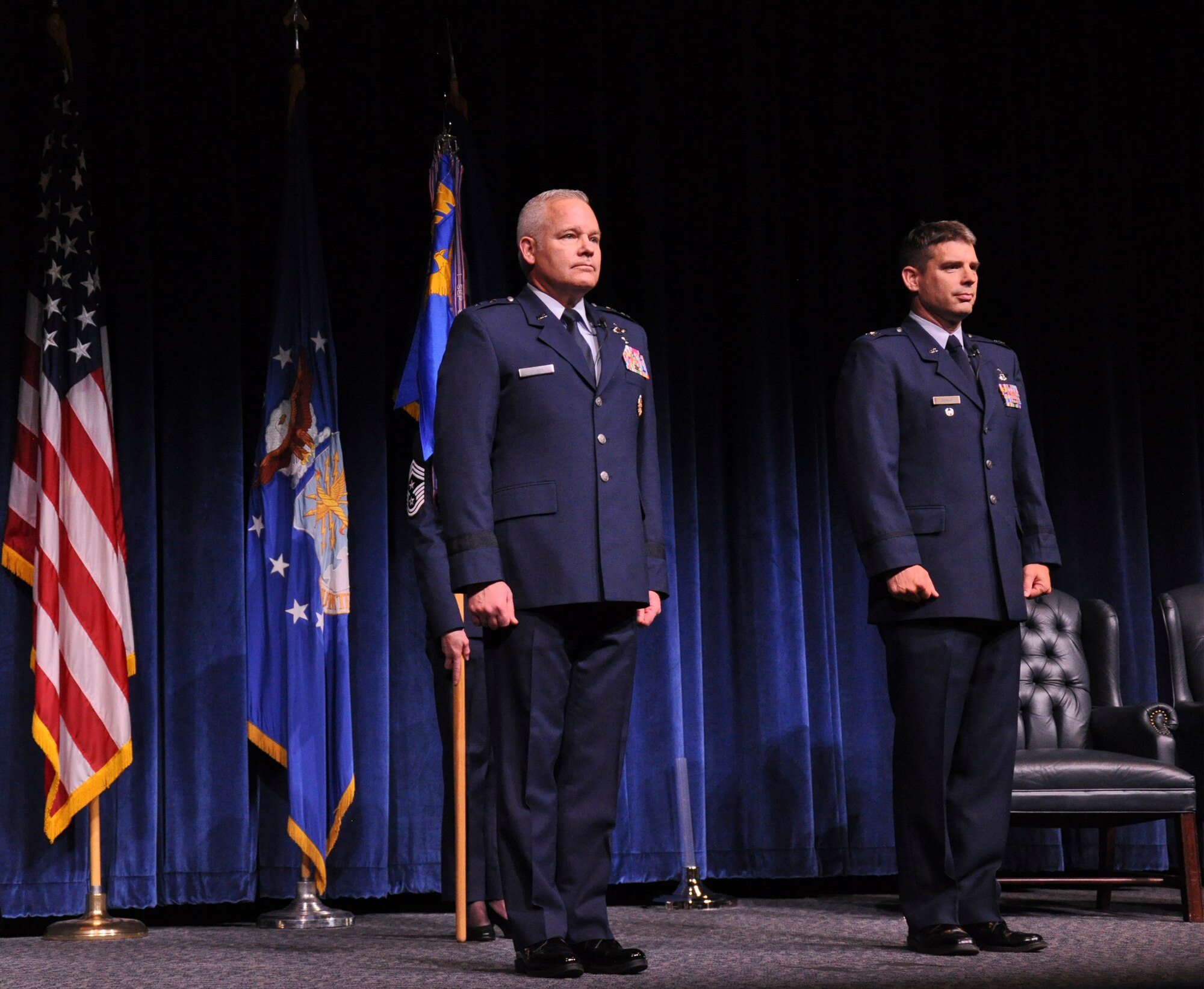 Commander of 22nd Air Force, Maj. Gen. John Stokes (left) prepares to transfer command of the 908th Airlift Wing to Col. Kenneth Ostrat during an Assumption of Command ceremony March 5 at Maxwell Air Force Base. Ostrat returns to the wing having previously been the director of operations for the 357th Airlift Squadron from July 2008 until December 2012. (U.S. Air Force photo by Staff Sgt. Malia Belton)