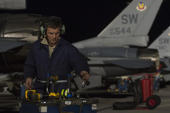 U.S. Air Force Airman 1st Class Jesse Fraley, 20th Component Maintenance Squadron aerospace propulsion technician, Shaw Air Force Base, S.C. prepares to put away his tools after completing routine maintenance on an F-16CM Fighting Falcon in support of Red Flag 17-2 at Nellis AFB, Nev., Feb. 28, 2017. Red Flag provides a series of intense air-to-air scenarios for aircrew and ground personnel in an effort to increase their combat readiness and effectiveness for future real-world missions. (U.S. Air Force photo by Senior Airman Zade Vadnais)