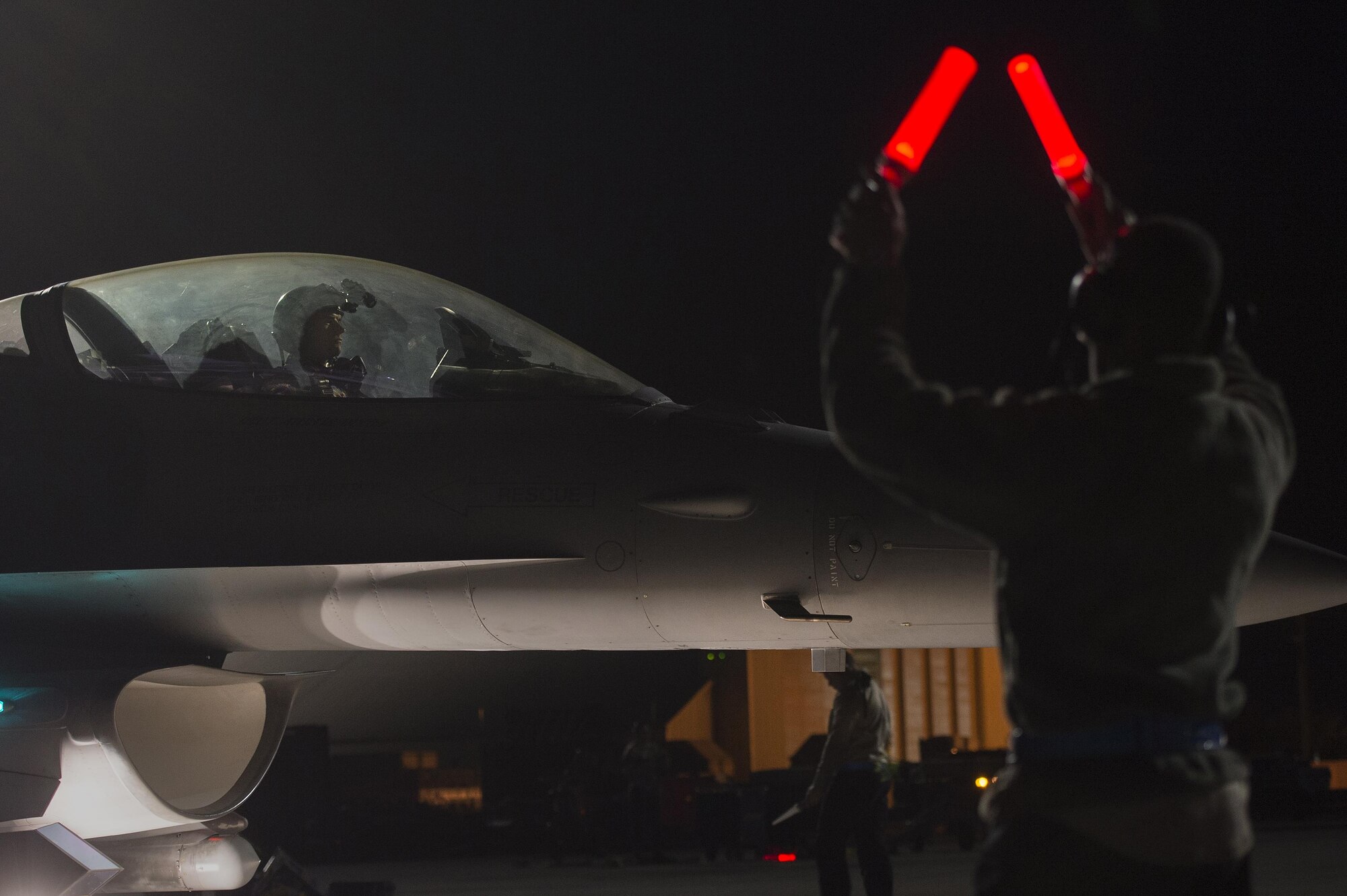 A U.S. Air Force pilot assigned to the 55th Fighter Squadron taxis onto the runway in preparation for a nighttime flying mission in support of Red Flag 17-2 at Nellis Air Force Base, Nev., Feb. 28, 2017. In addition to daytime operations, Red Flag conducts training exercises during hours of darkness to train for low-visibility environments. (U.S. Air Force photo by Senior Airman Zade Vadnais)
